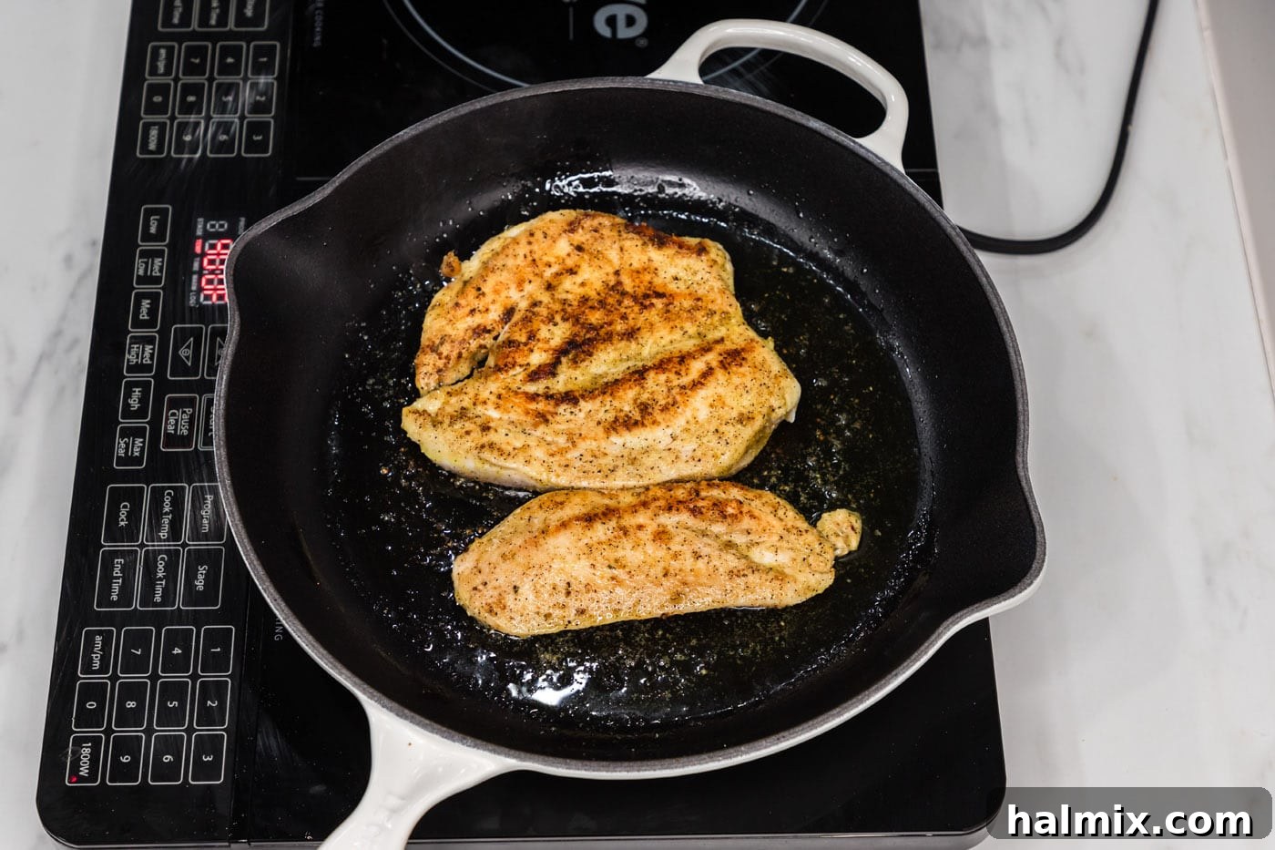 cooking chicken breast in a skillet
