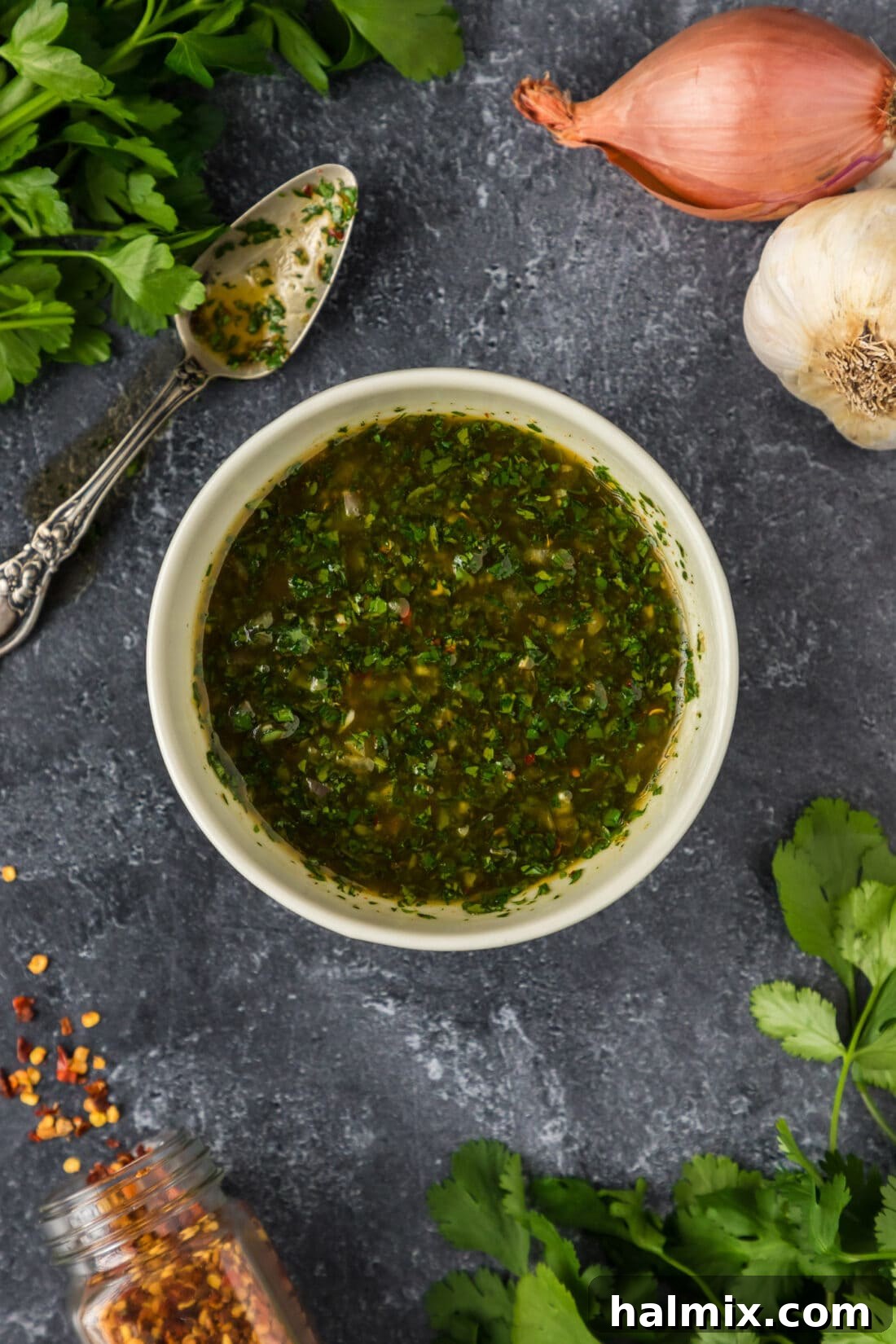 Easy Homemade Chimichurri Sauce Bowl of vibrant green homemade chimichurri sauce, ready to be served.
