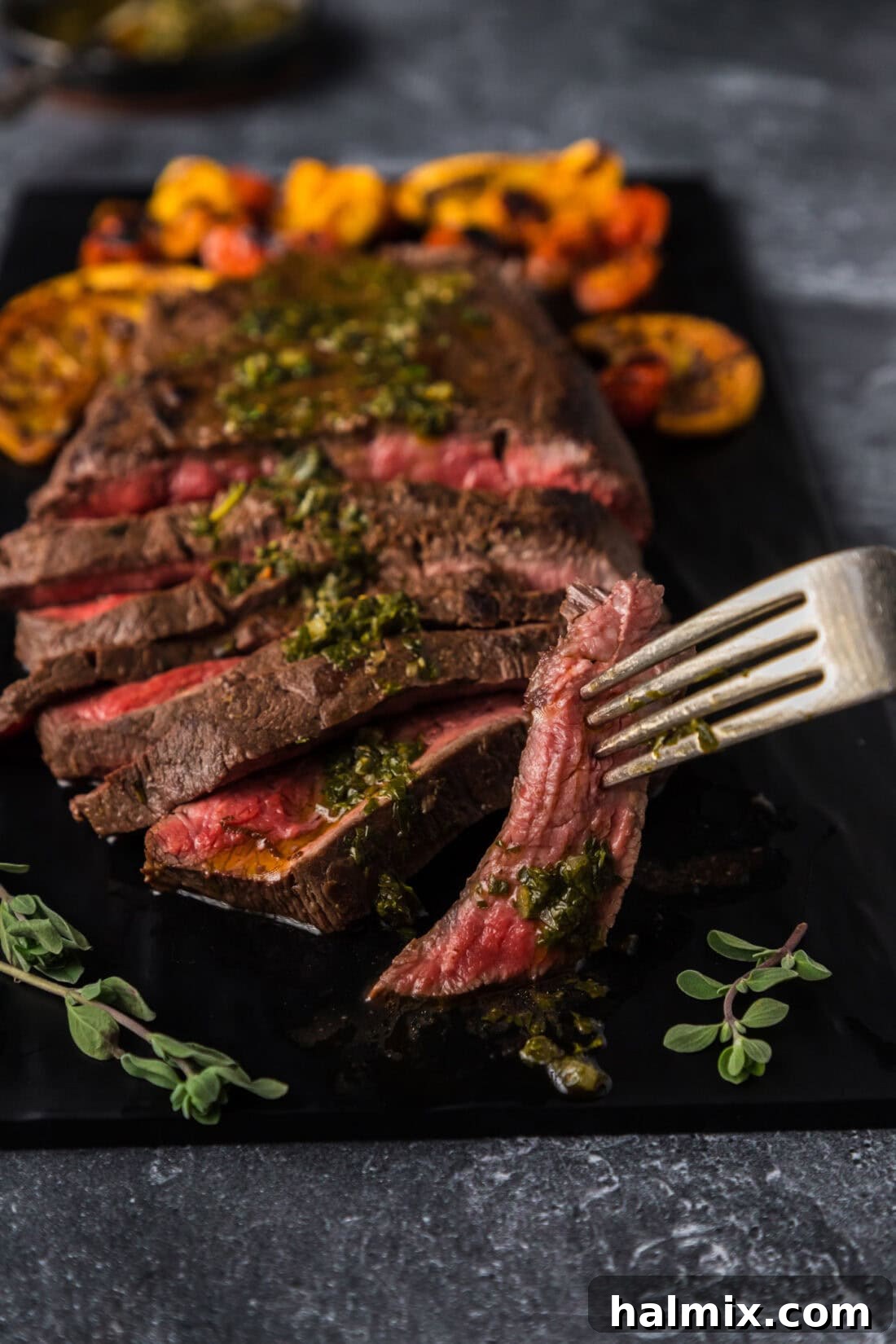 Piece of Flat Iron Steak on a fork