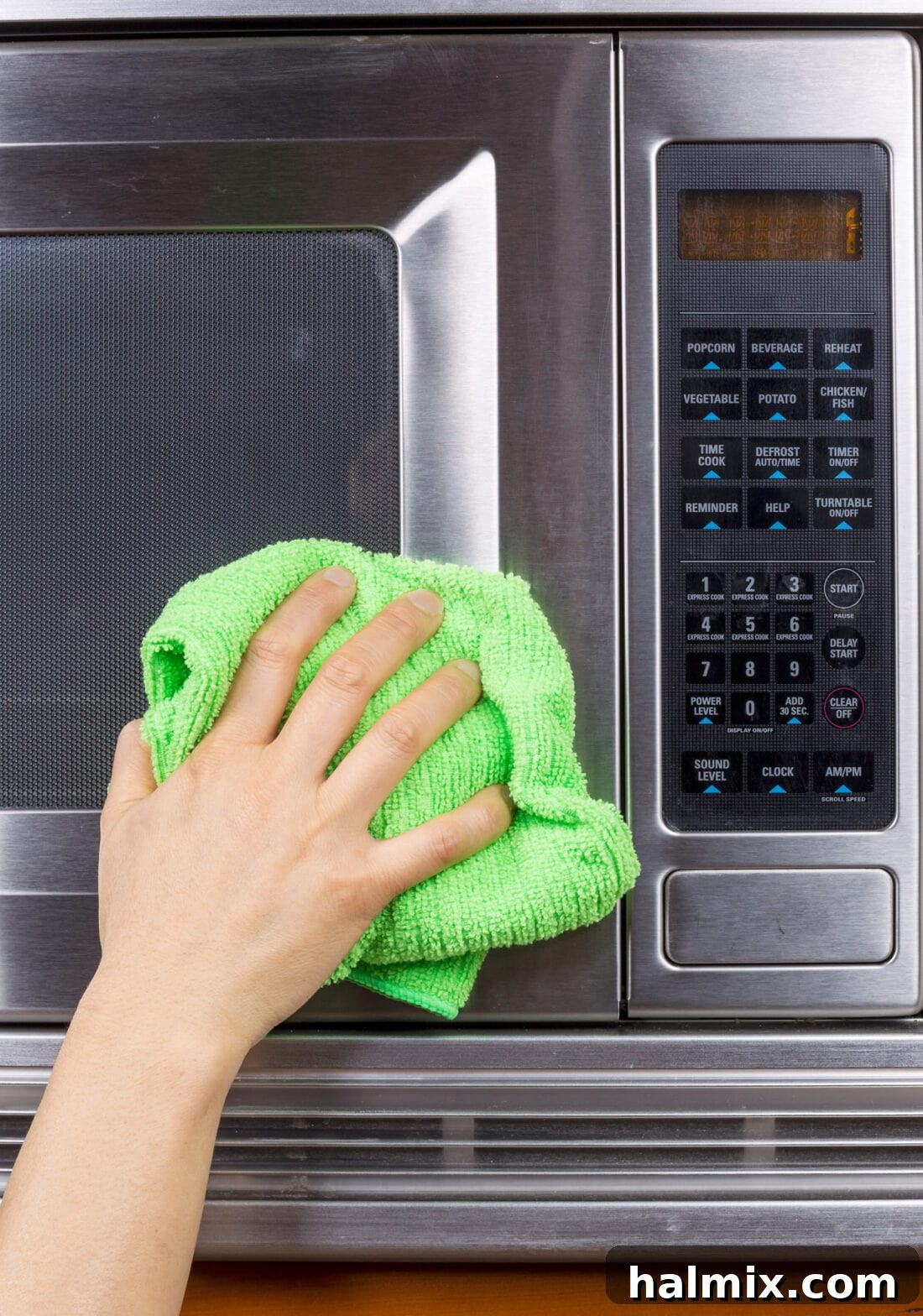 Clean microwave interior with a bowl of water and lemon slices