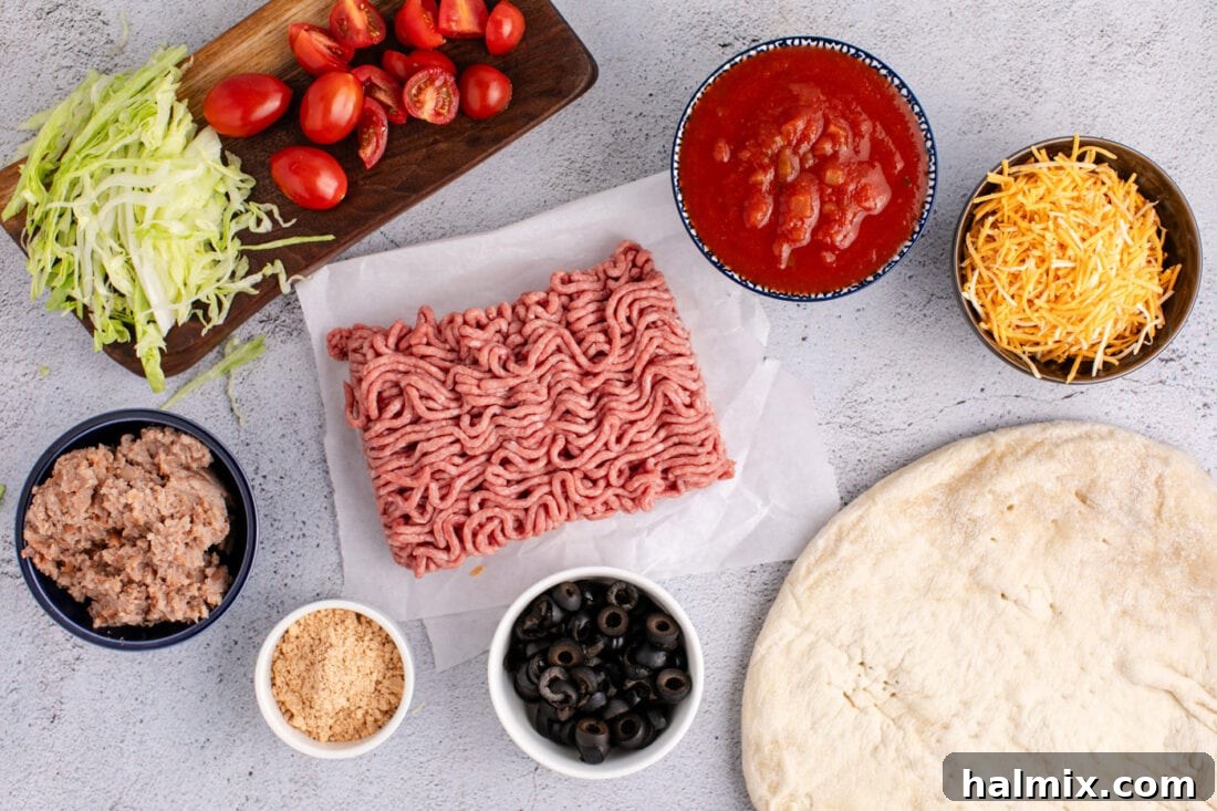 Arrangement of fresh ingredients for Taco Pizza including ground beef, seasoning, beans, salsa, and toppings