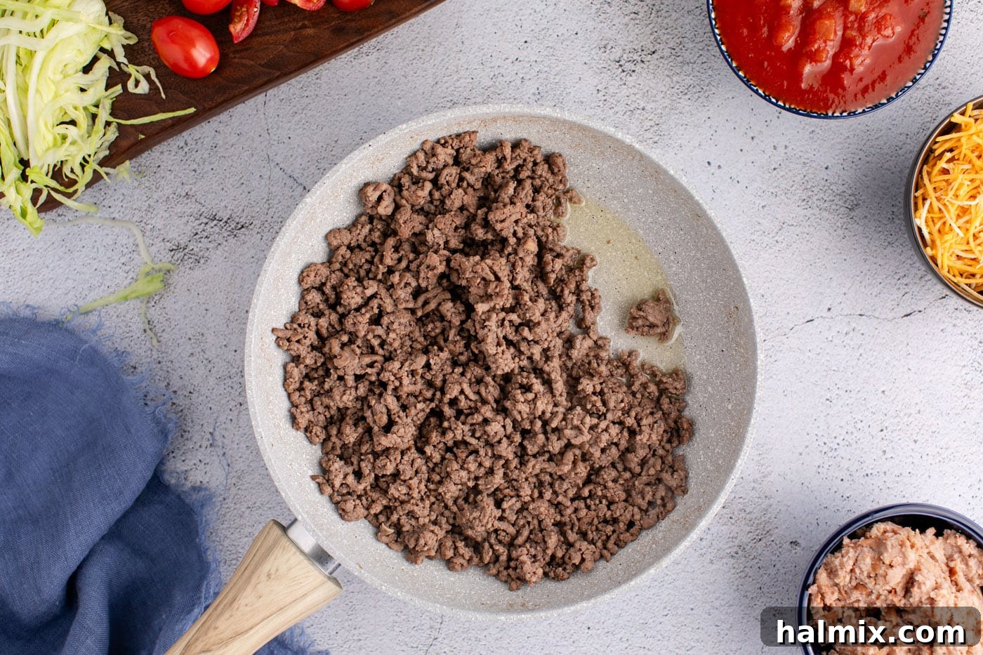 Taco meat browning in a skillet