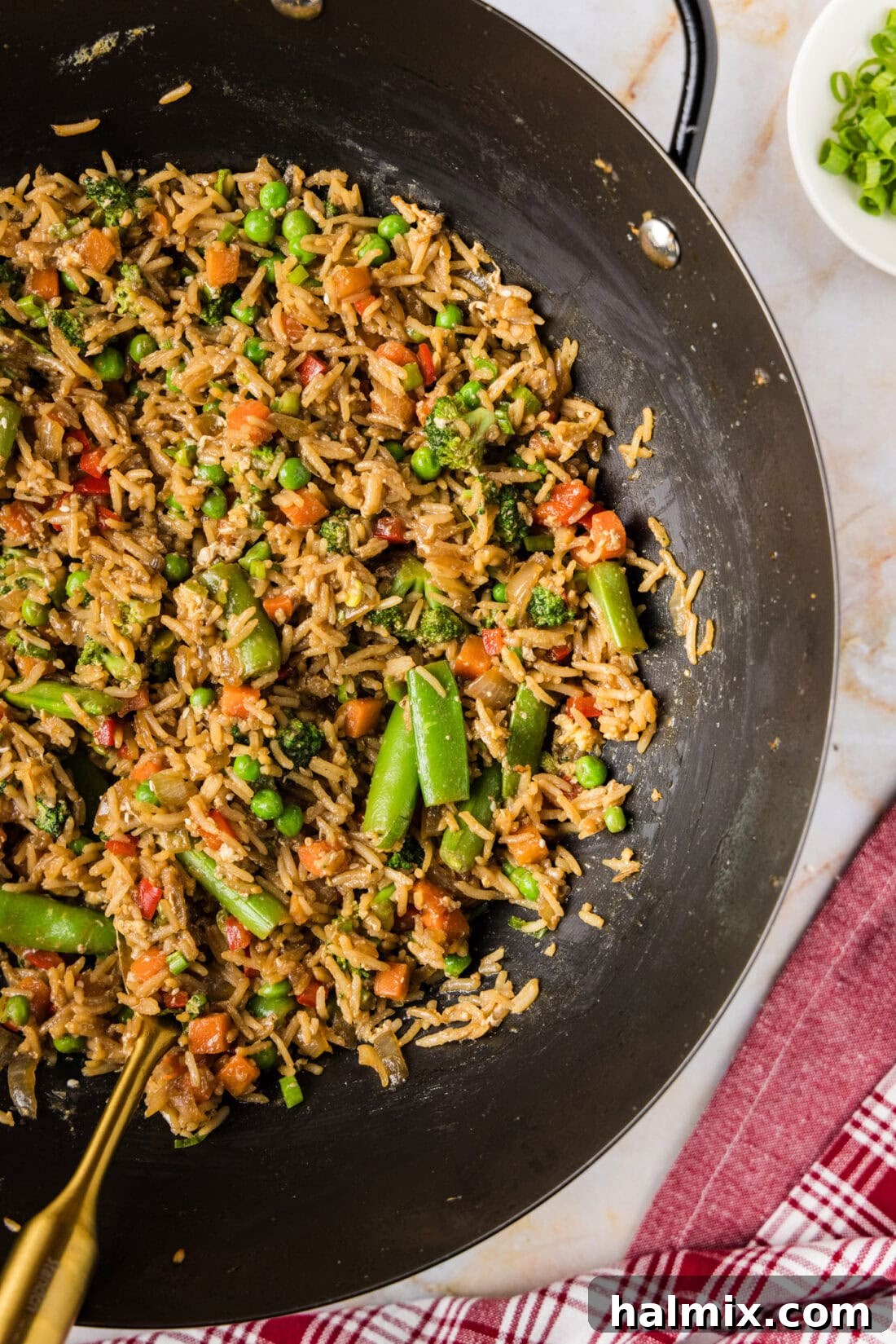 Close up photo of a wok of Vegetable Fried Rice