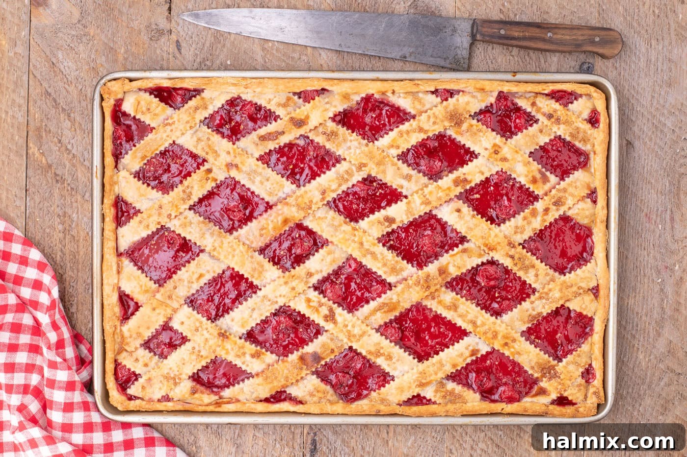 overhead of baked cherry slab pie in jelly roll pan