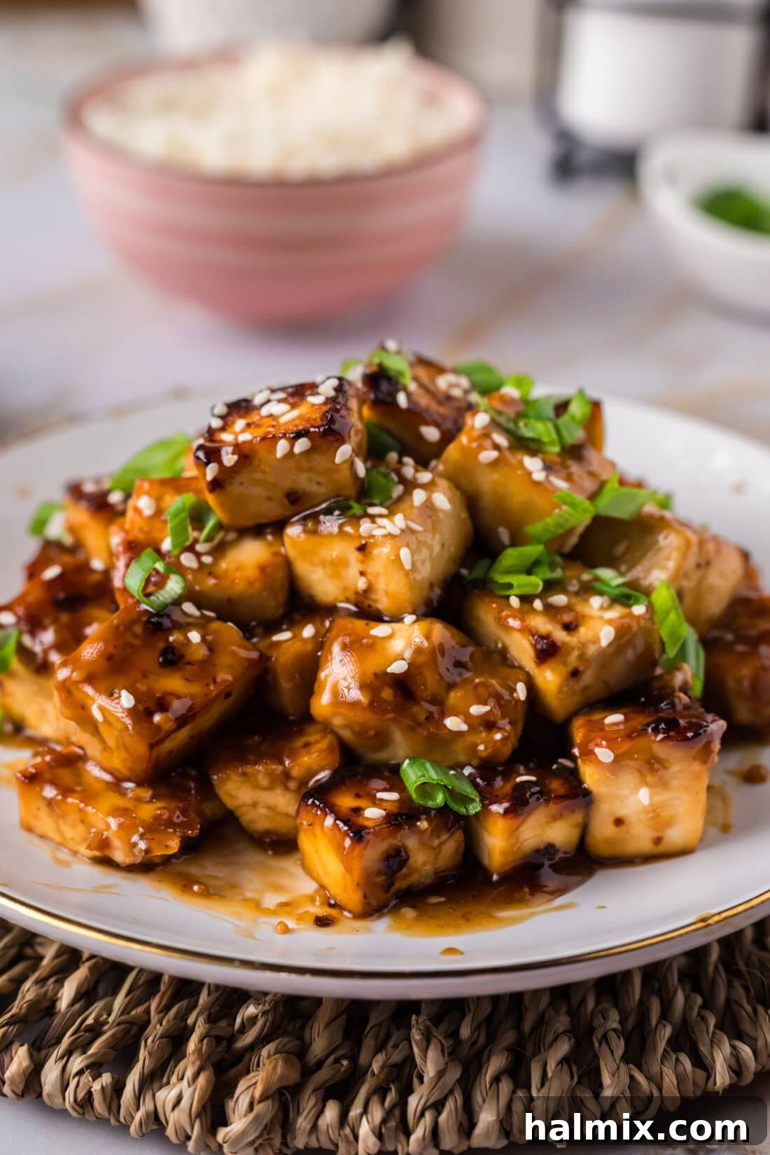 Sticky Honey Garlic Tofu 13 Honey Garlic Tofu piled up on a plate, ready to be served as a delicious meal.