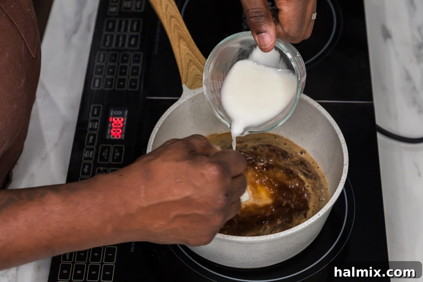 Sticky Honey Garlic Tofu 10 Whisking a cornstarch slurry into the simmering honey garlic sauce in a saucepan to achieve a perfect thickness.
