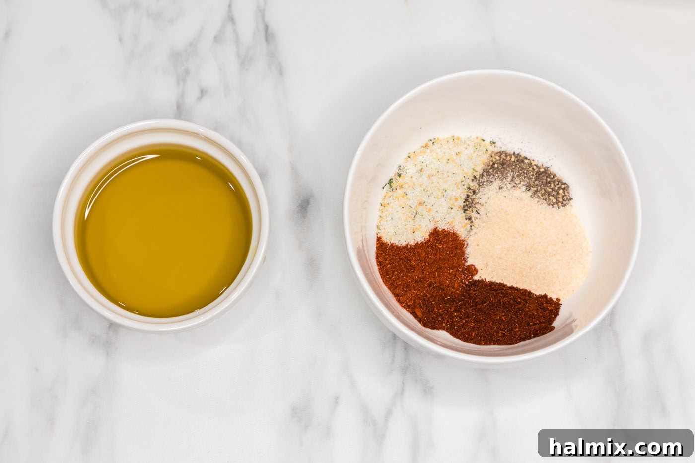 oil in a bowl next to seasoning blend