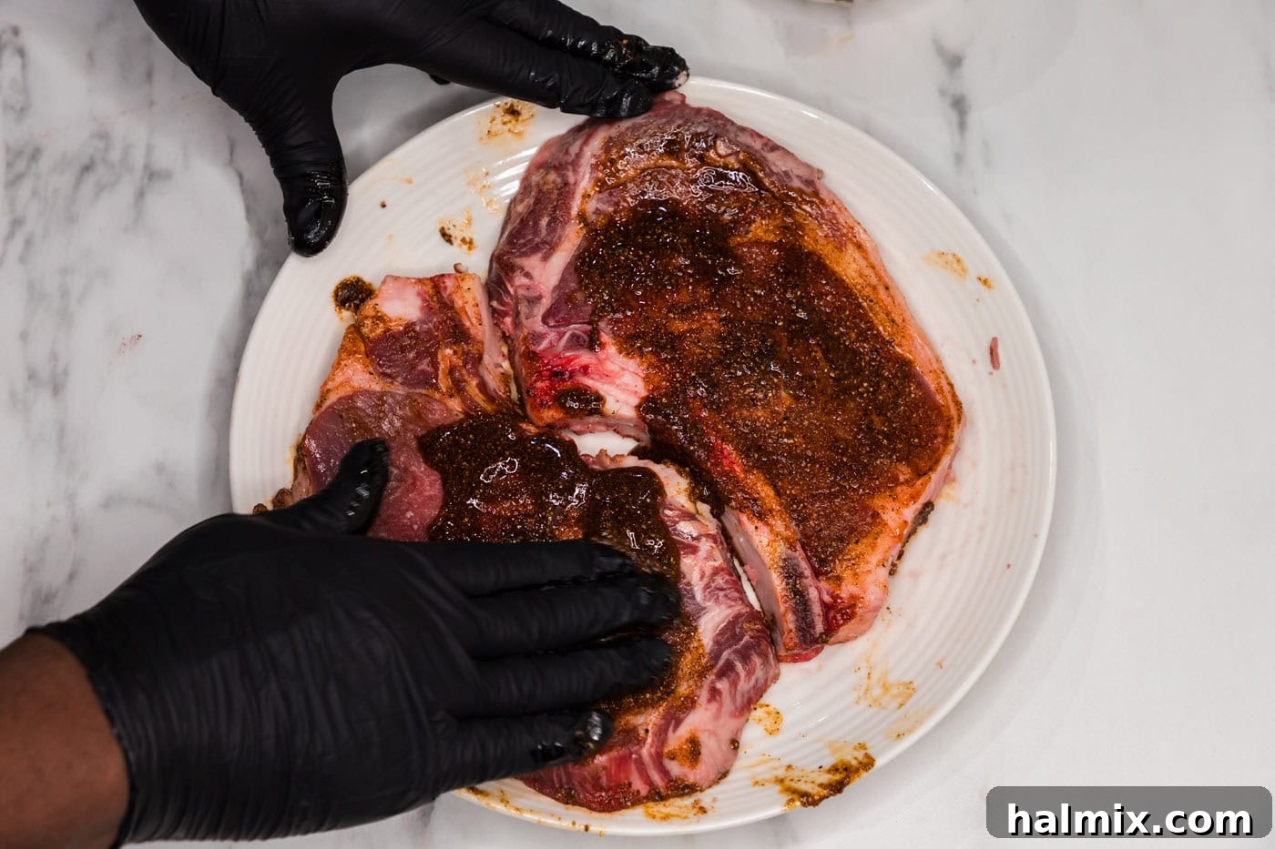 rubbing ribeye steaks with a wet rub