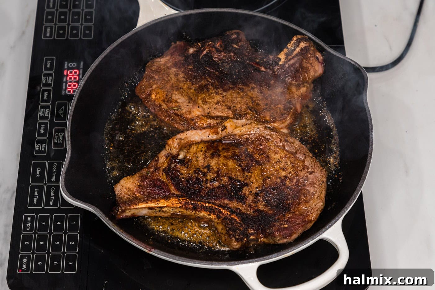 seared ribeye steaks in a skillet