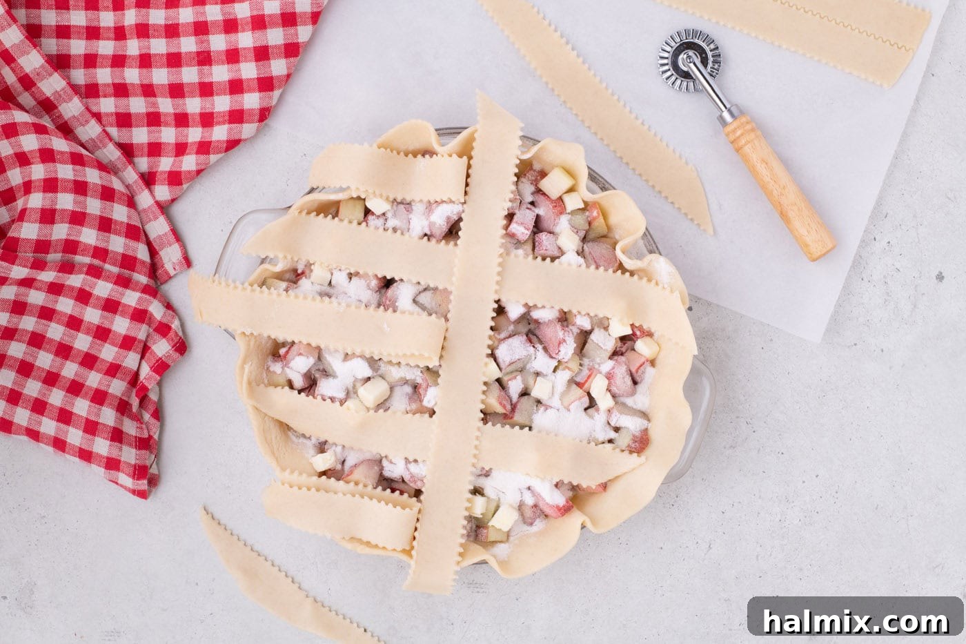 Tangy Rhubarb Delight 12 Alternating strips of pie crust folded back to begin weaving the lattice top.