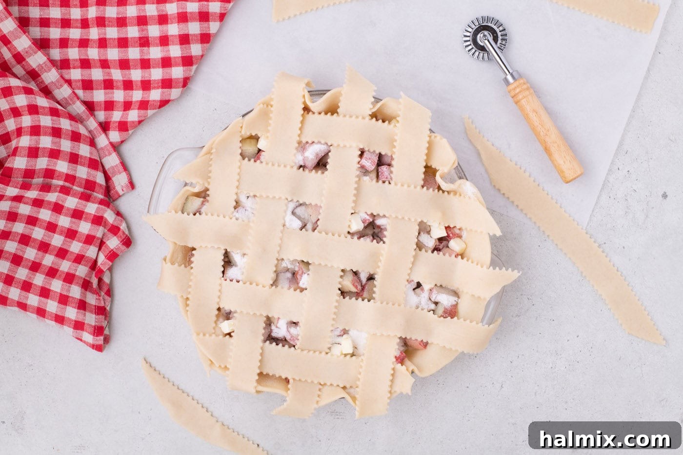 Tangy Rhubarb Delight 16 Close-up of a meticulously woven lattice top on a rhubarb pie, ready for baking.