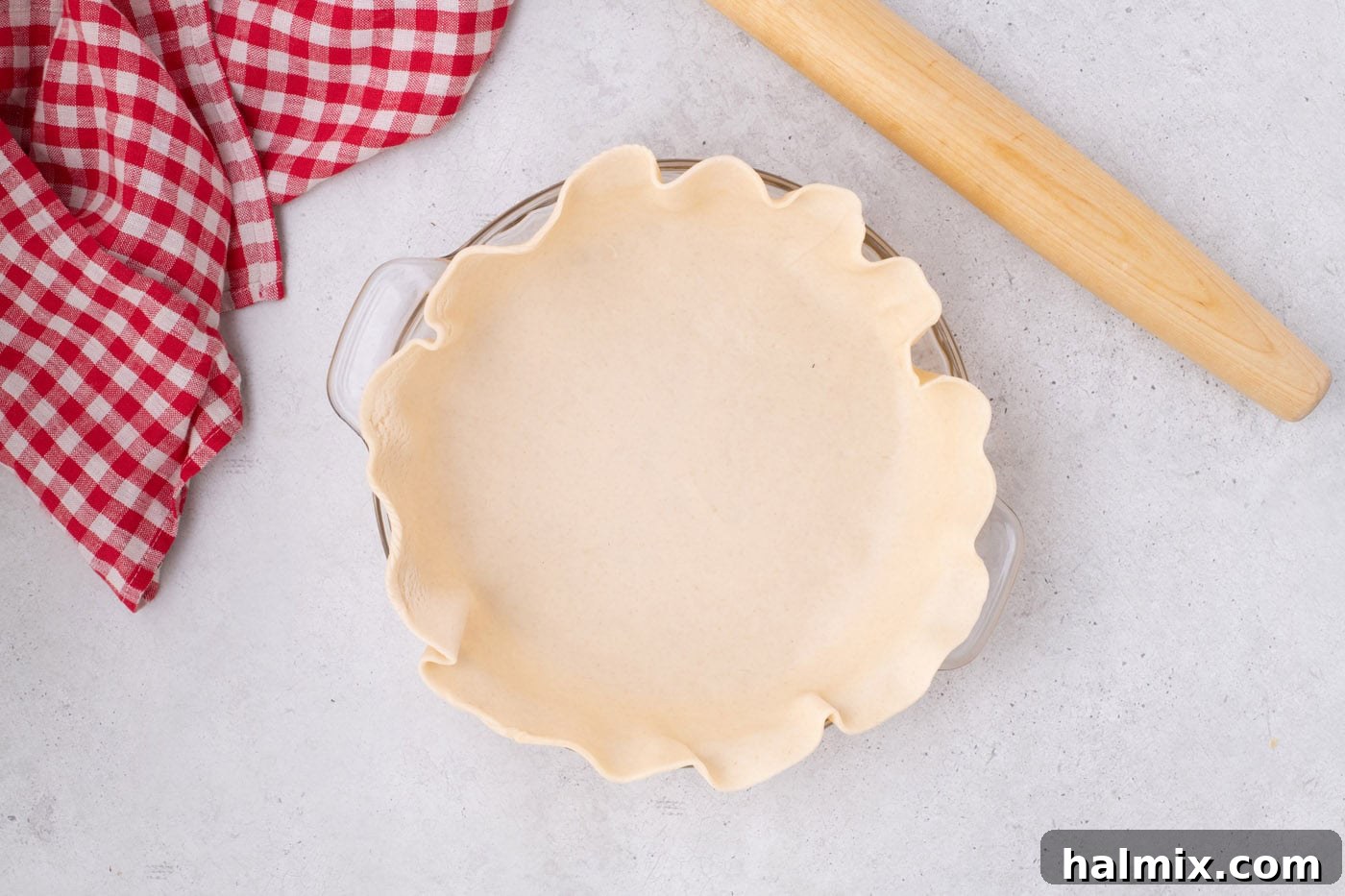 Tangy Rhubarb Delight 6 A pie crust neatly placed into a pie pan, ready for filling.