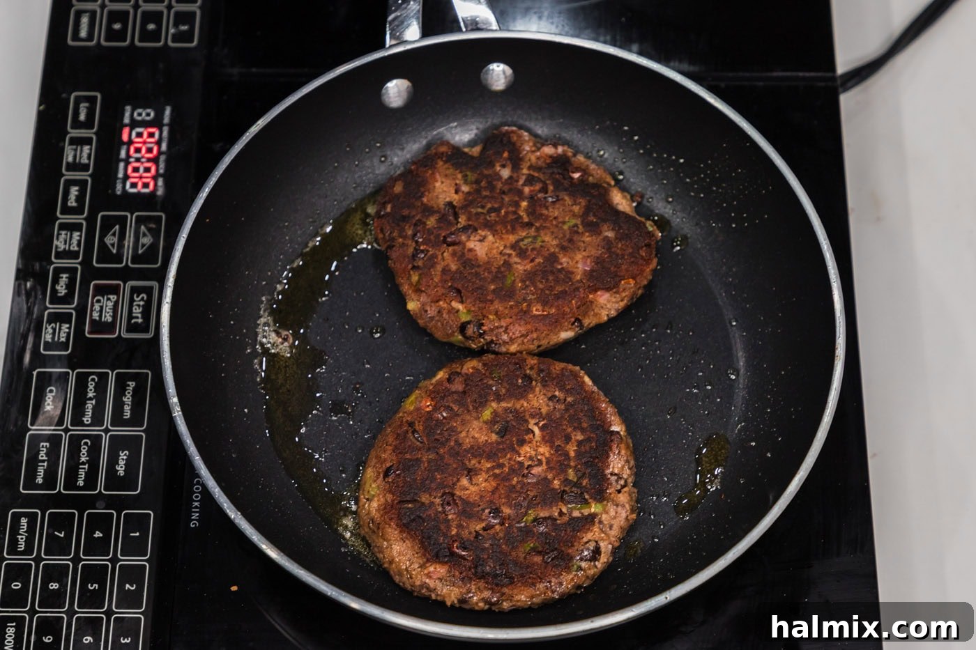 cooked black bean burgers in a skillet