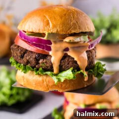 Black Bean Burger lifted up on a spatula