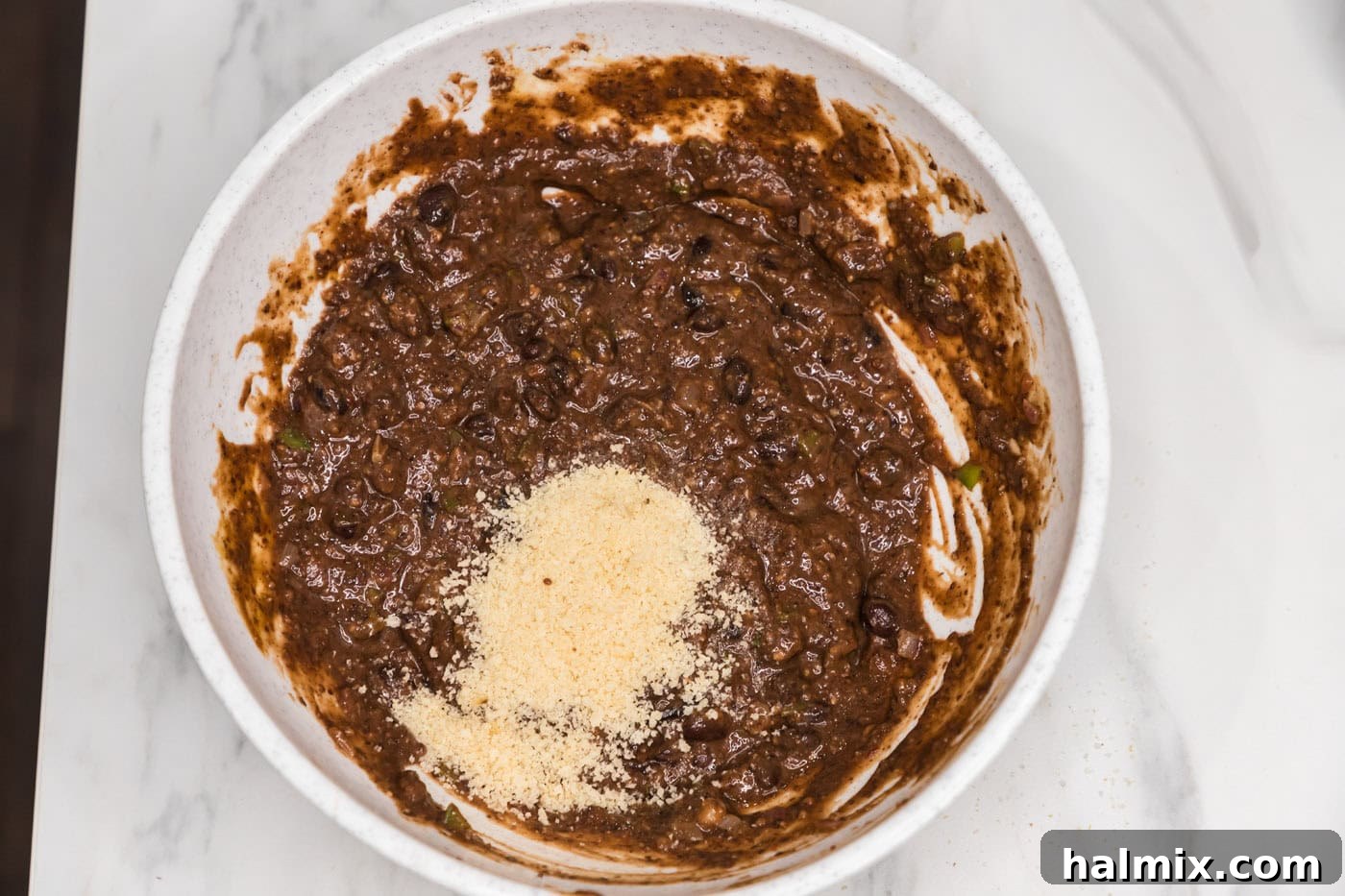 breadcrumbs added to bowl with black bean mixture