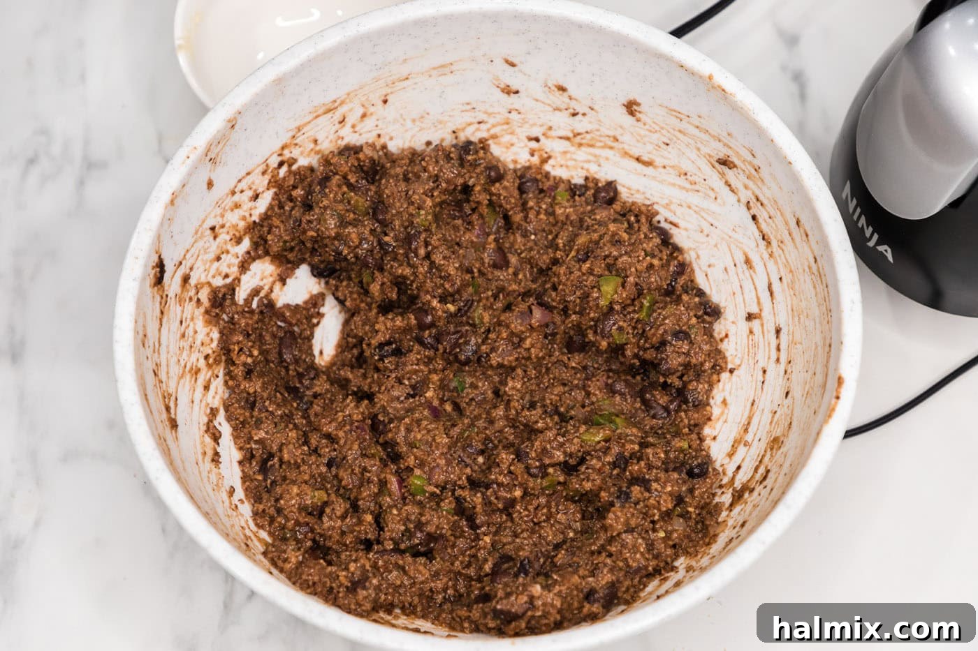 black bean burger mixture in a mixing bowl