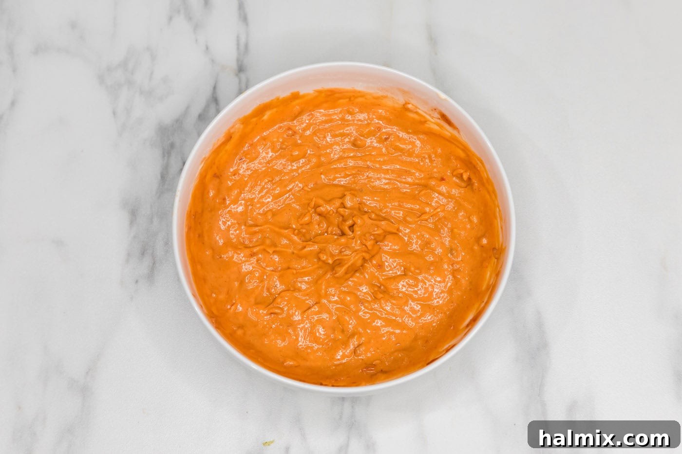 Thunder Shrimp 6 Smooth and creamy Boom Boom sauce in a bowl, ready for the shrimp.