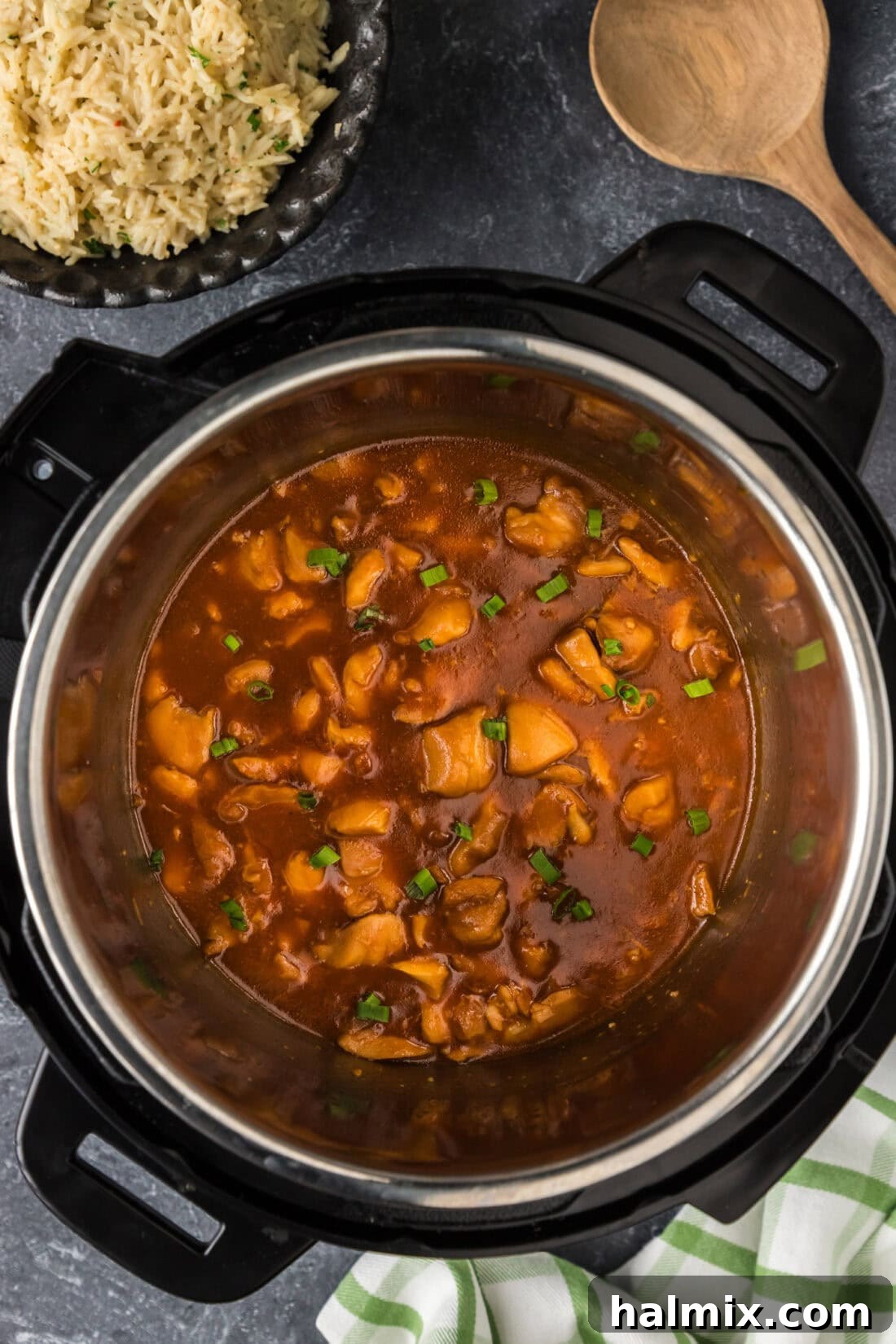 Sweet and Sticky Instant Pot Bourbon Chicken 3 Instant Pot filled with succulent Bourbon Chicken, highlighting the rich, sticky sauce coating the tender chicken pieces, ready to be served.