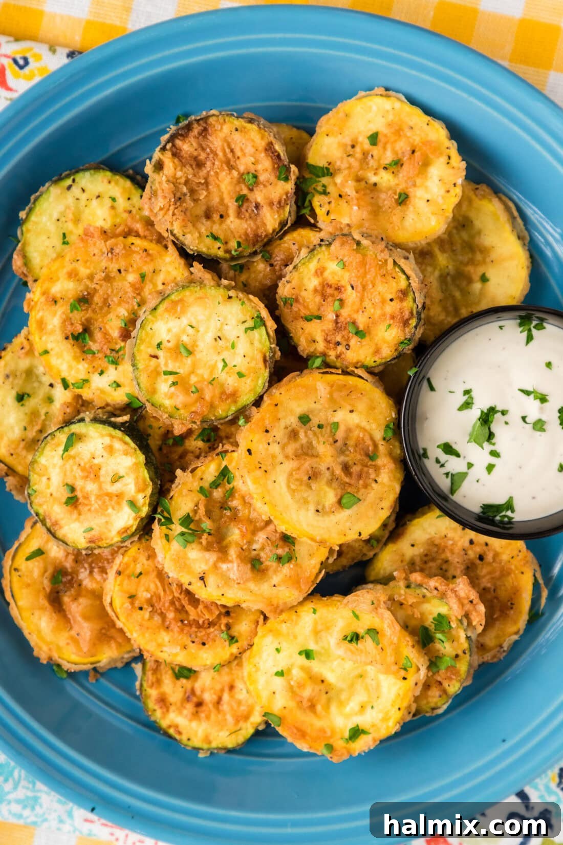 Golden Fried Squash 3 Close up photo of a plate of golden-brown Fried Squash, highlighting its crispy texture.