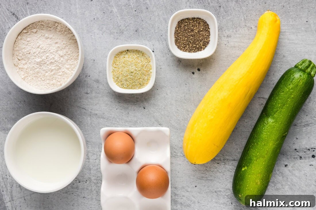 Golden Fried Squash 4 A display of fresh ingredients for making Fried Squash, including yellow squash, zucchini, eggs, buttermilk, flour, and spices.