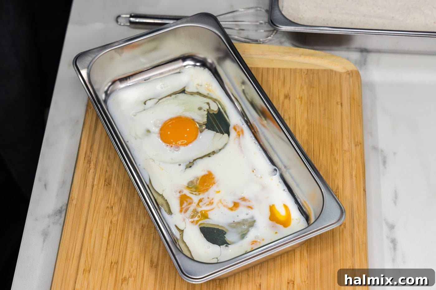 Golden Fried Squash 6 A breading tray filled with eggs and buttermilk, ready to be whisked.