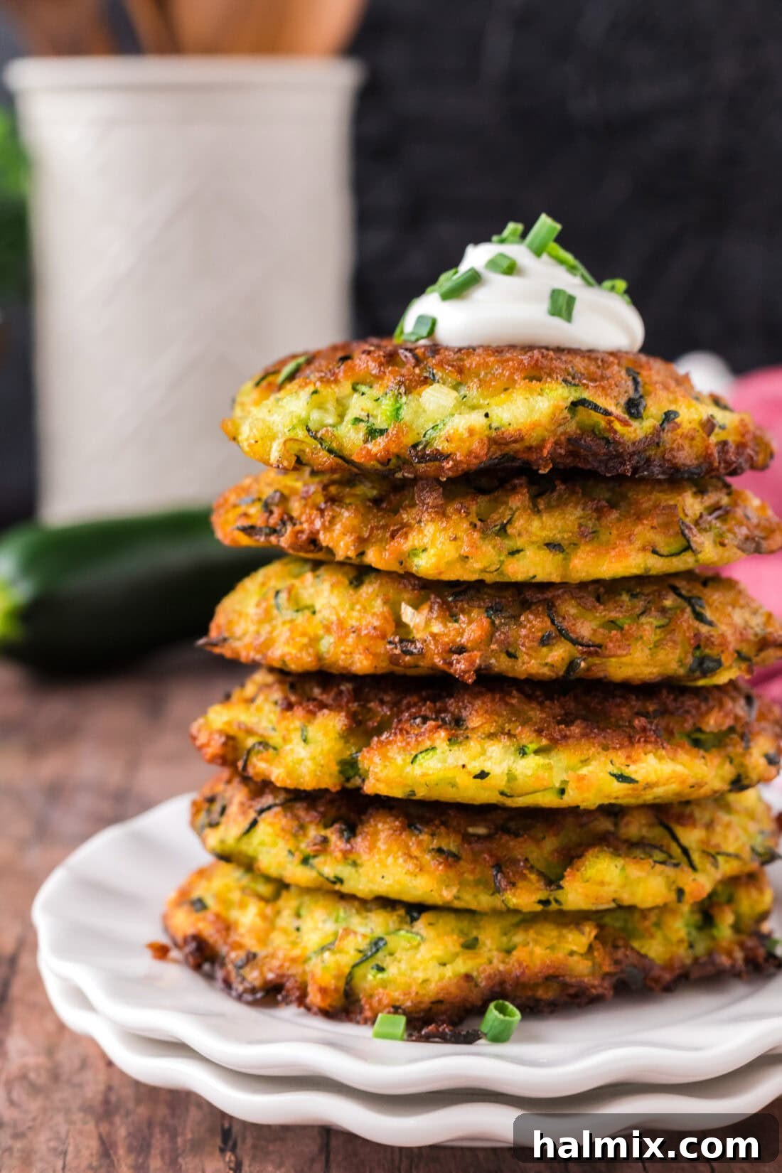 Golden Zucchini Delights 2 Close up photo of a stack of golden-brown Zucchini Fritters, showcasing their crisp texture
