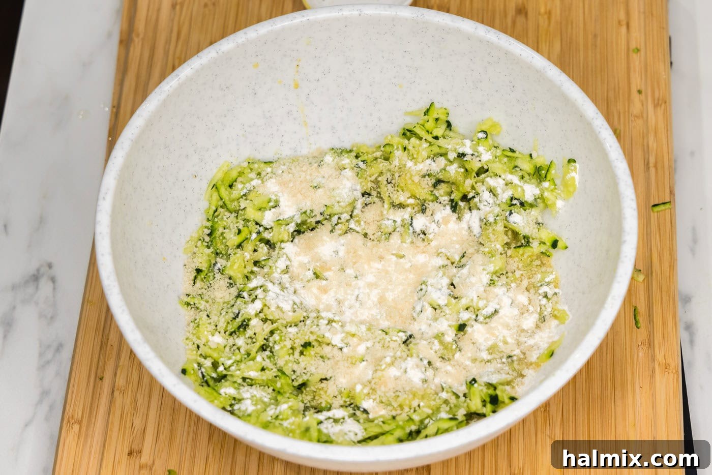 Golden Zucchini Delights 8 Flour and panko breadcrumbs being added to the zucchini mixture