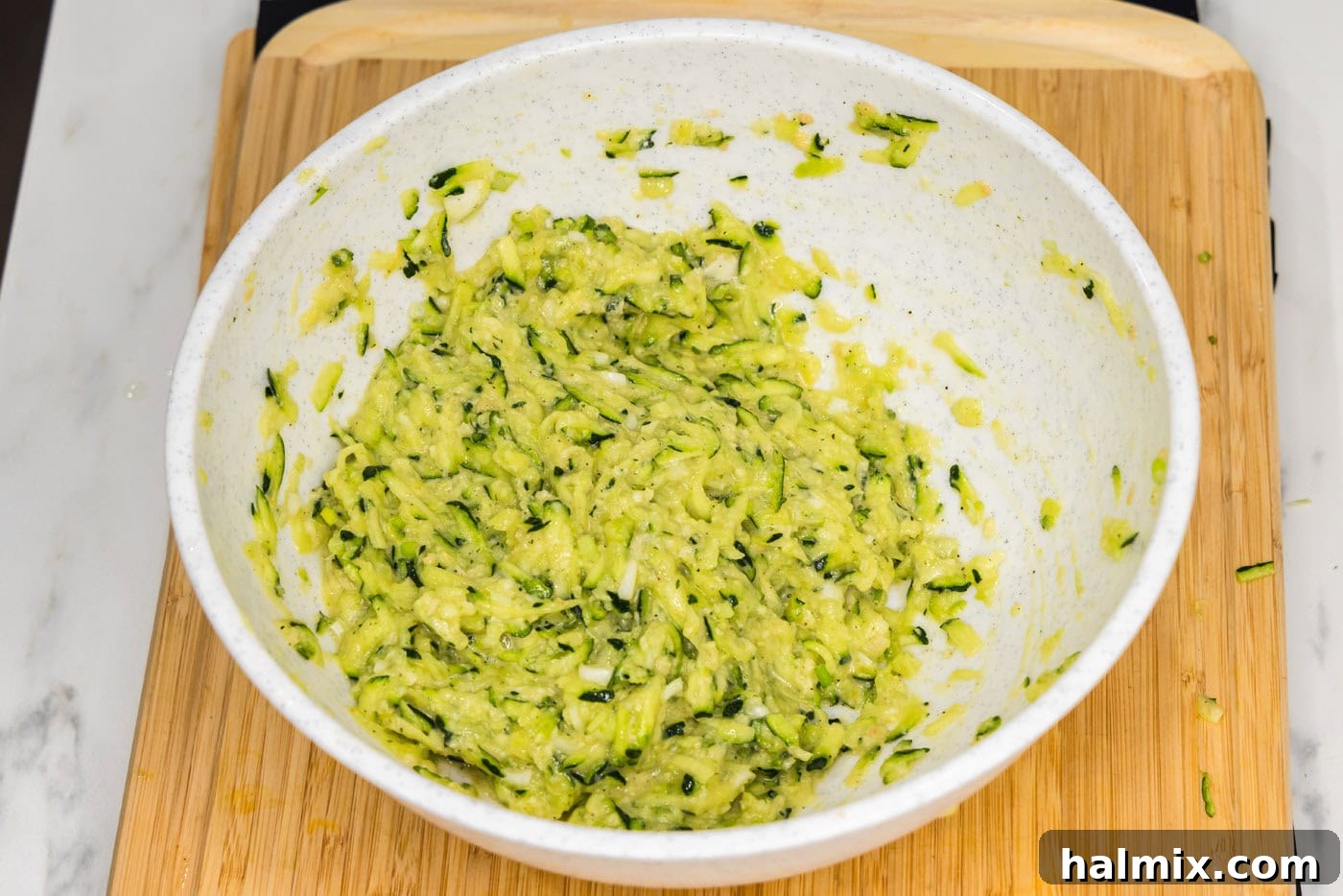 Golden Zucchini Delights 9 The fully combined zucchini fritter mixture in a bowl, ready for forming