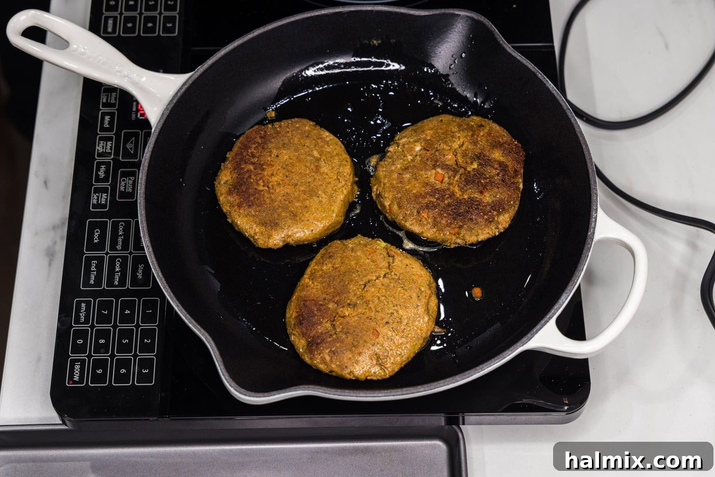 cooking veggie burger patties in a skillet