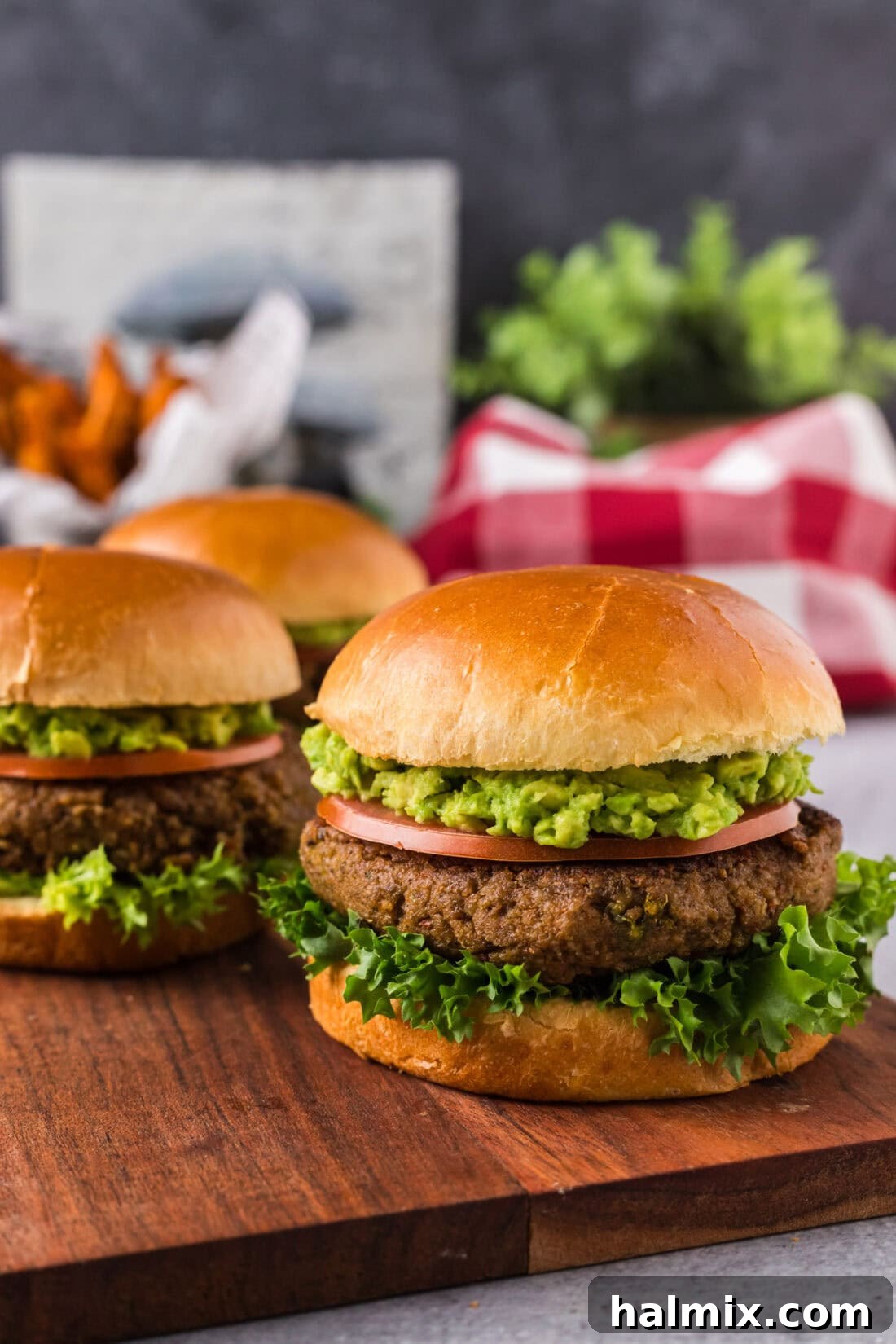 Three Veggie Burgers on a wooden serving platter