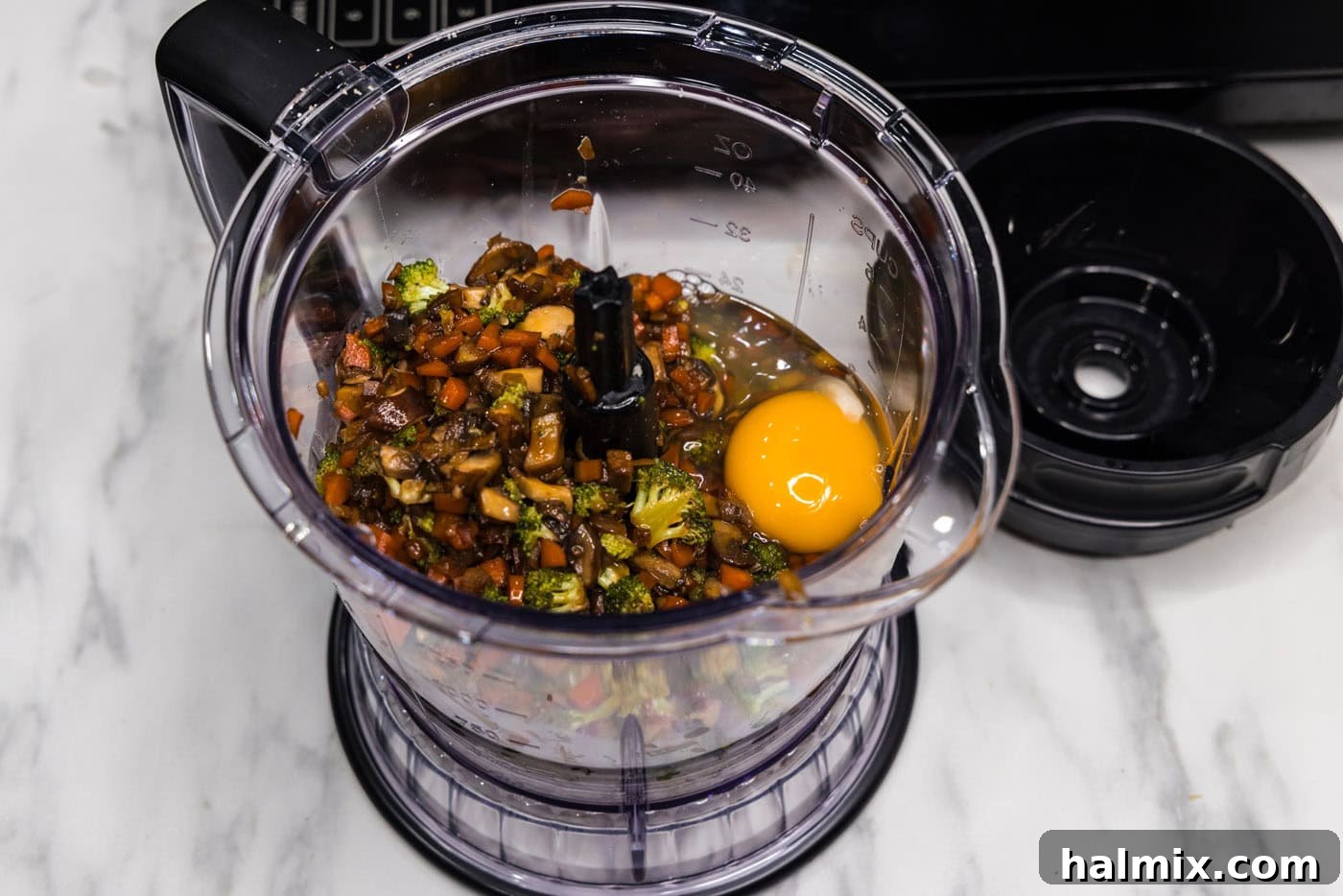 eggs and vegetable mixture in a food processor