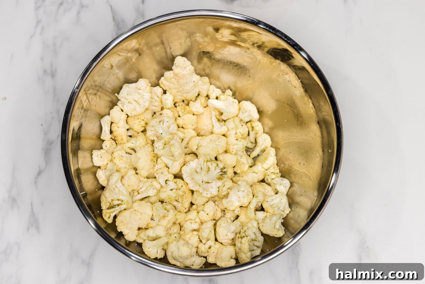 seasoned cauliflower florets in a bowl