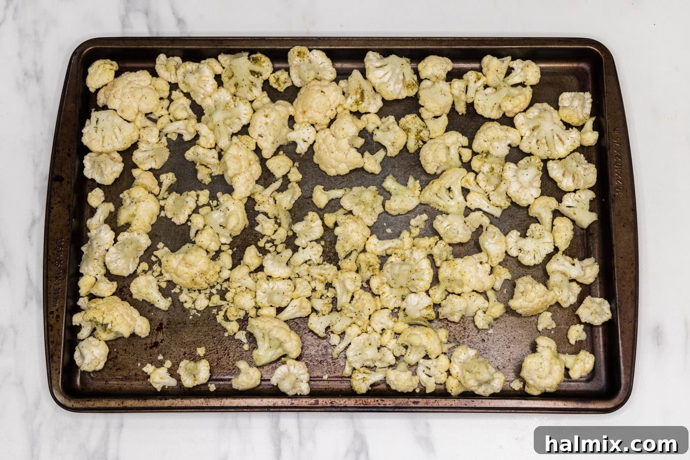 cauliflower florets on a baking sheet