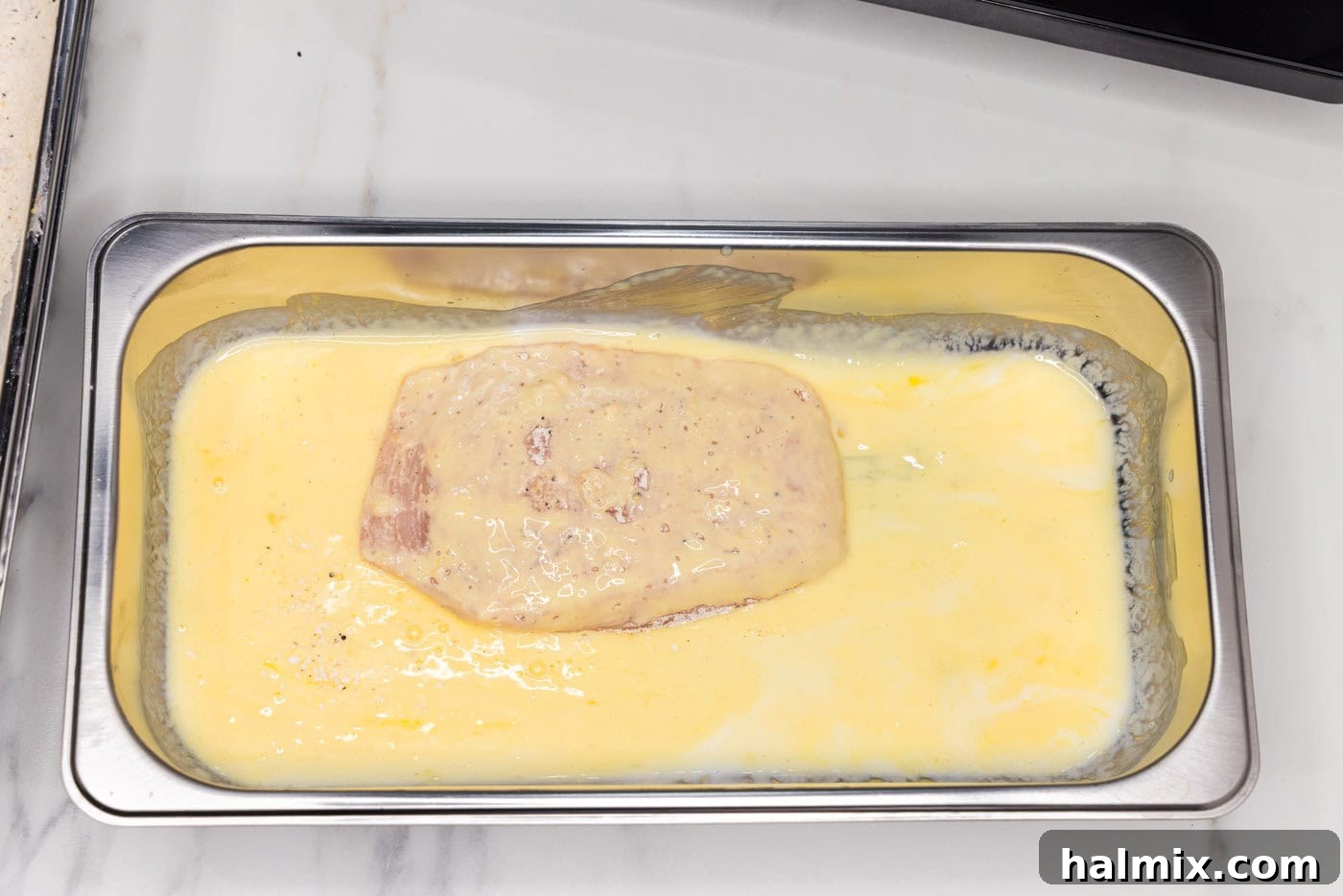 dredged chicken breast in buttermilk mixture