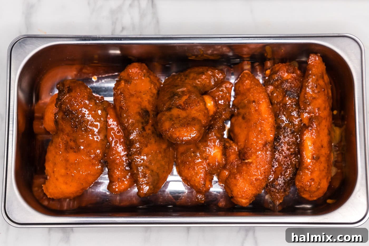 buffalo chicken tenders on a pan