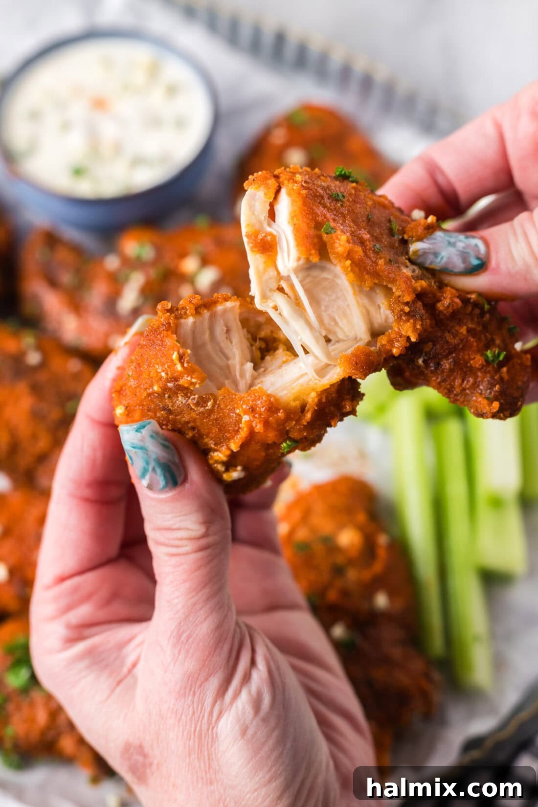 Buffalo Chicken Tender broken in half