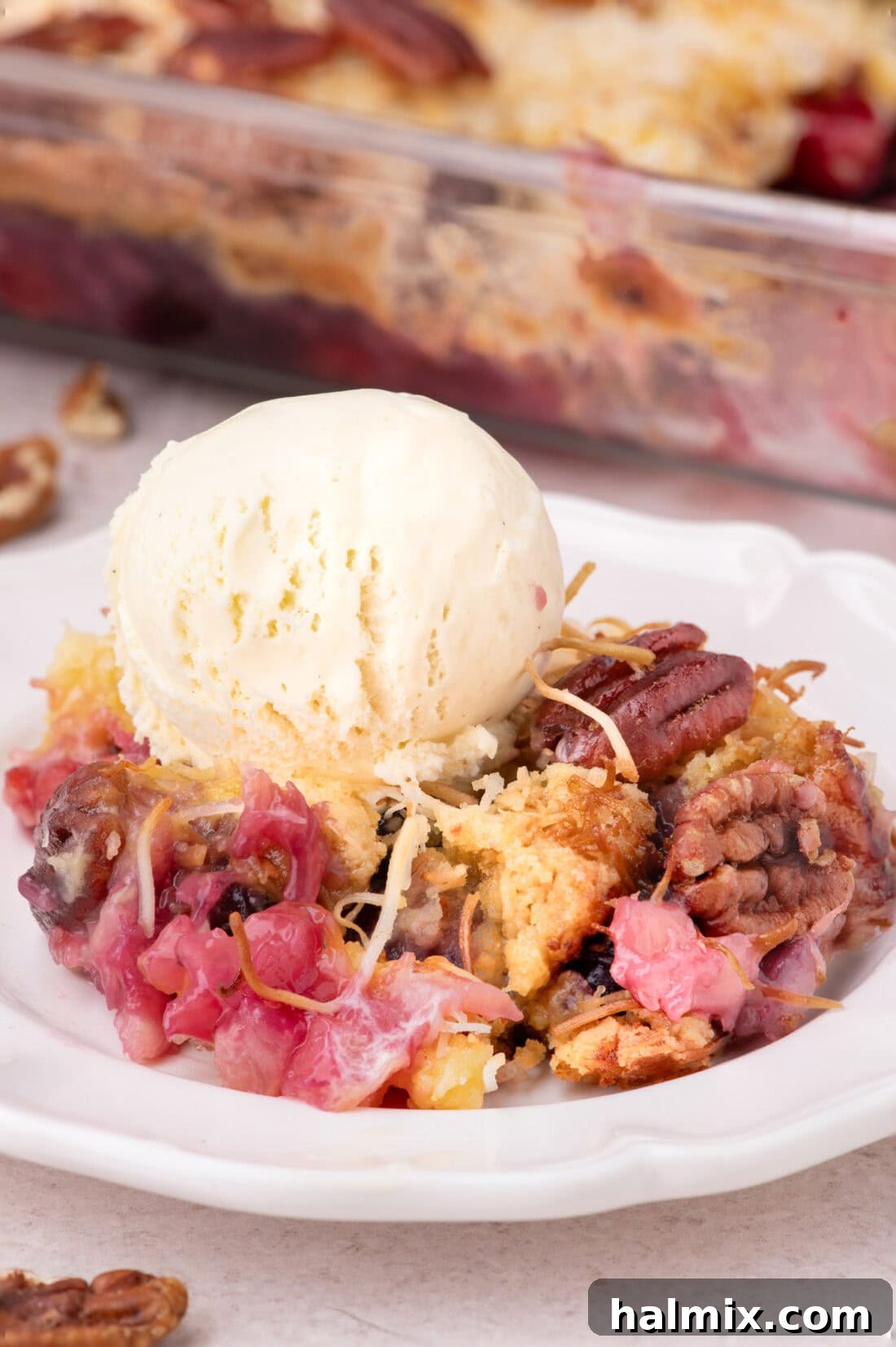 Serving of Texas Pie on a plate topped with ice cream