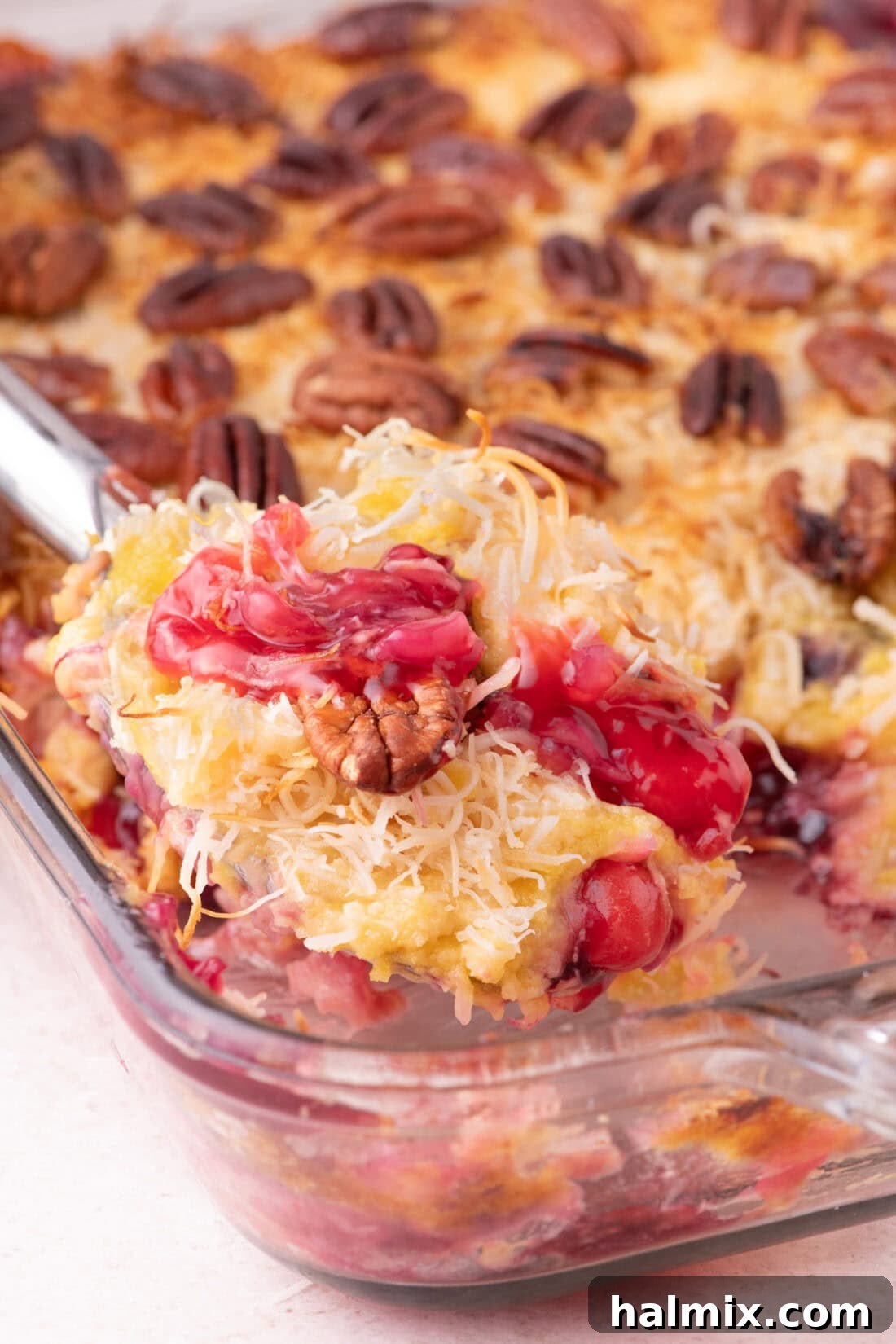 Spoonful of Texas Pie being lifted out of the baking dish