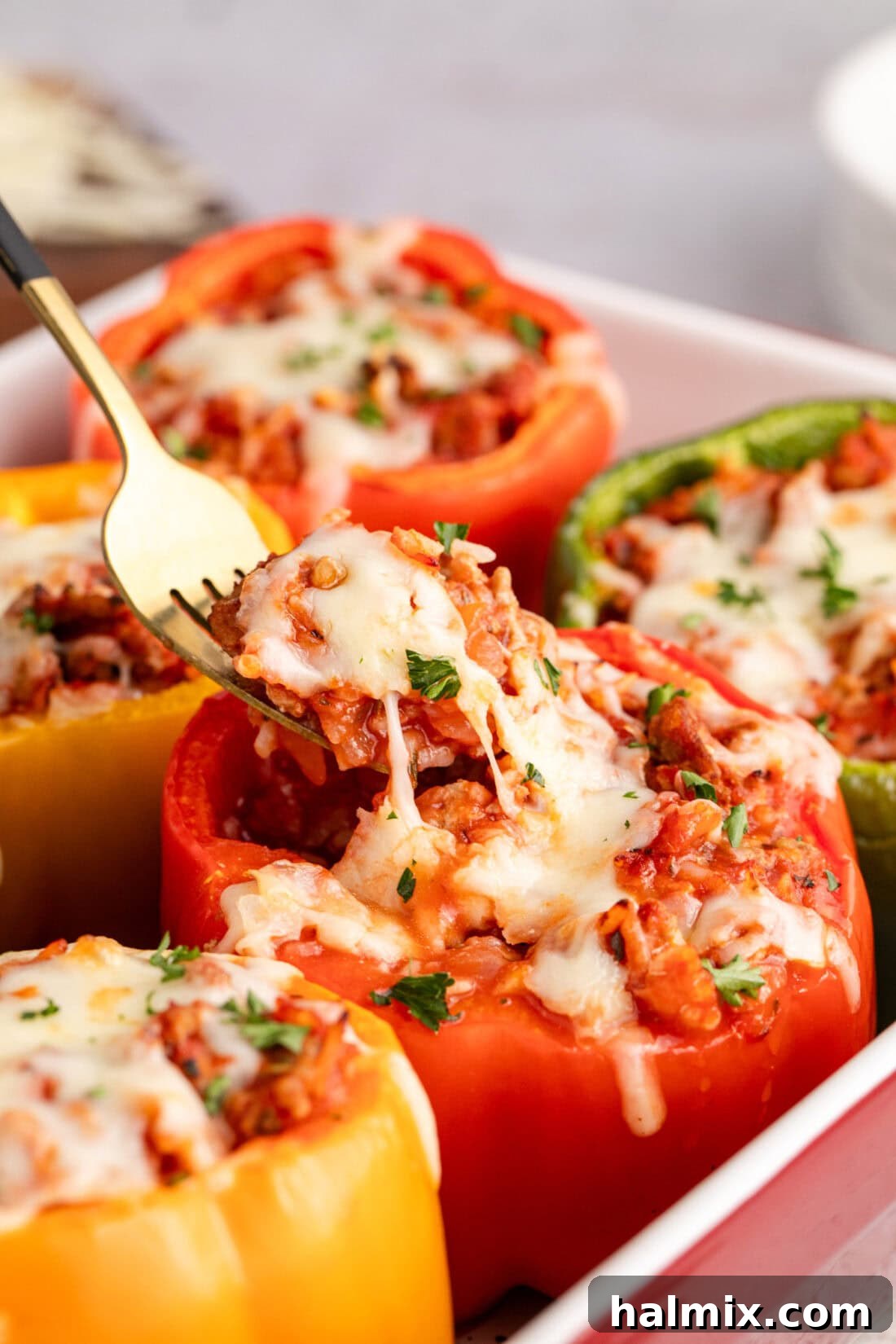 Fork picking up filling from a Turkey Stuffed Pepper