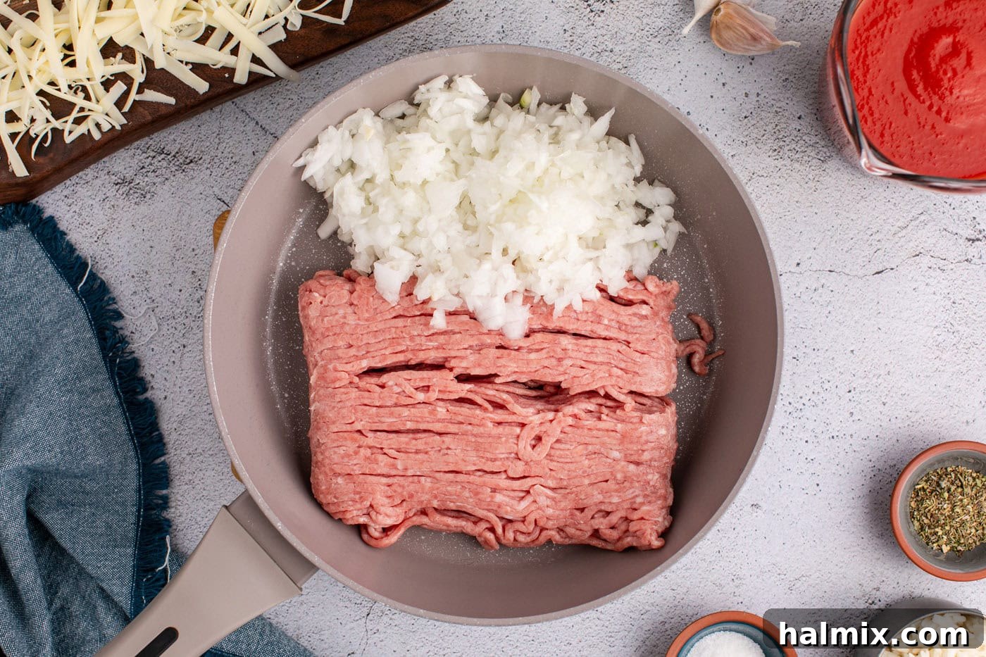 grund turkey and chopped onion in a skillet