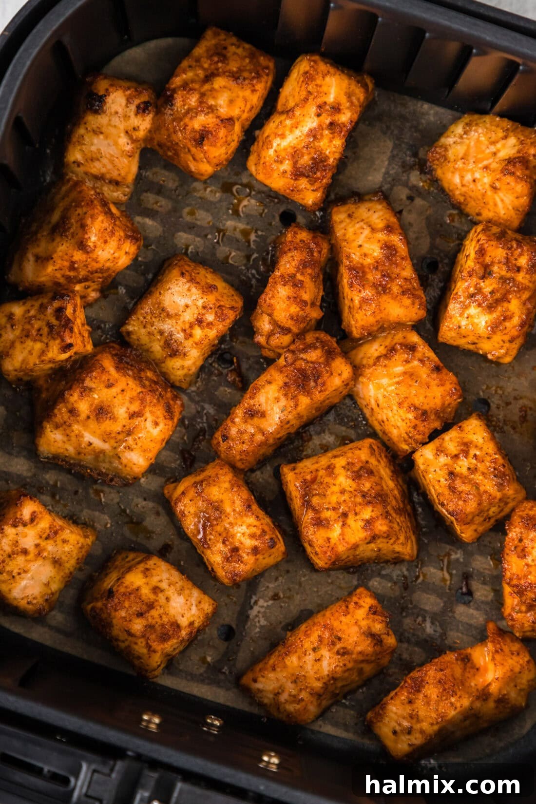 Golden Air Fryer Salmon Bites 3 Close up photo of Air Fryer Salmon Bites in an air fryer