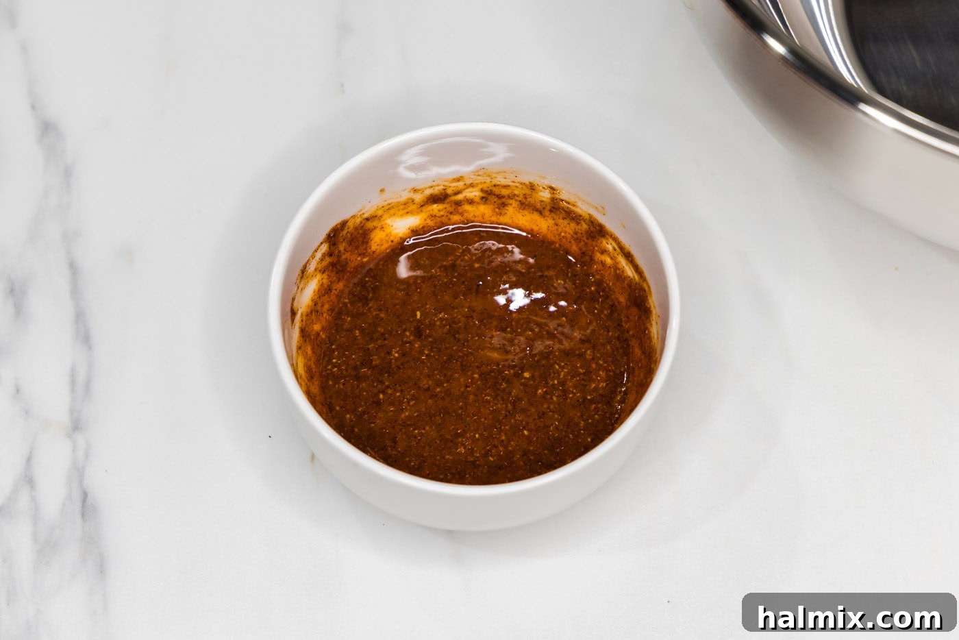 Golden Air Fryer Salmon Bites 7 wet rub for salmon mixed in a bowl