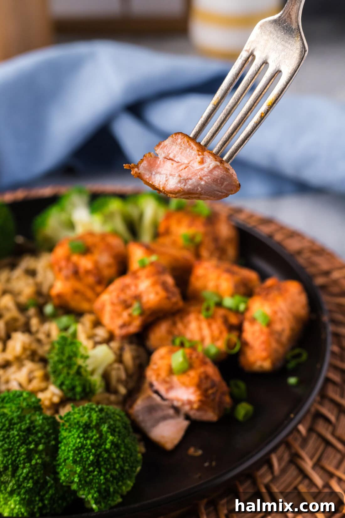 Golden Air Fryer Salmon Bites 10 Air Fryer Salmon Bite on a fork with a bite taken out