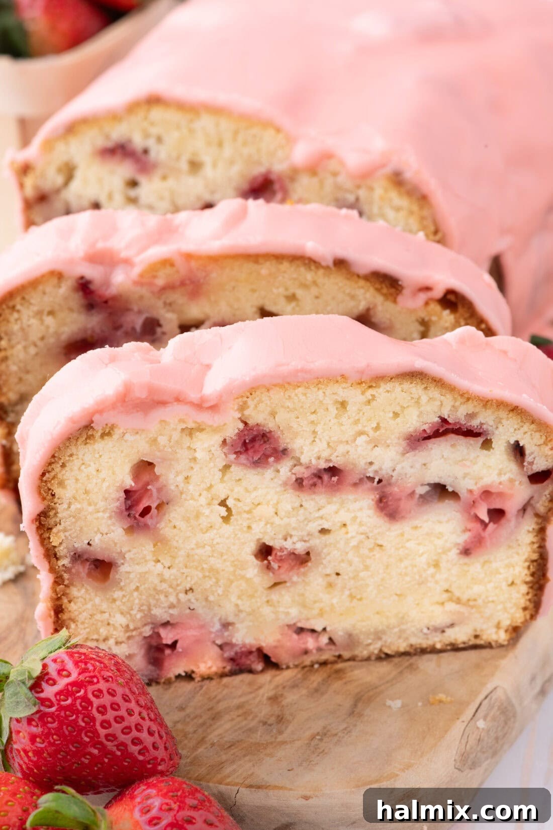 Fresh Strawberry Pound Cake 2 Slices of Strawberry Pound Cake on a wooden board