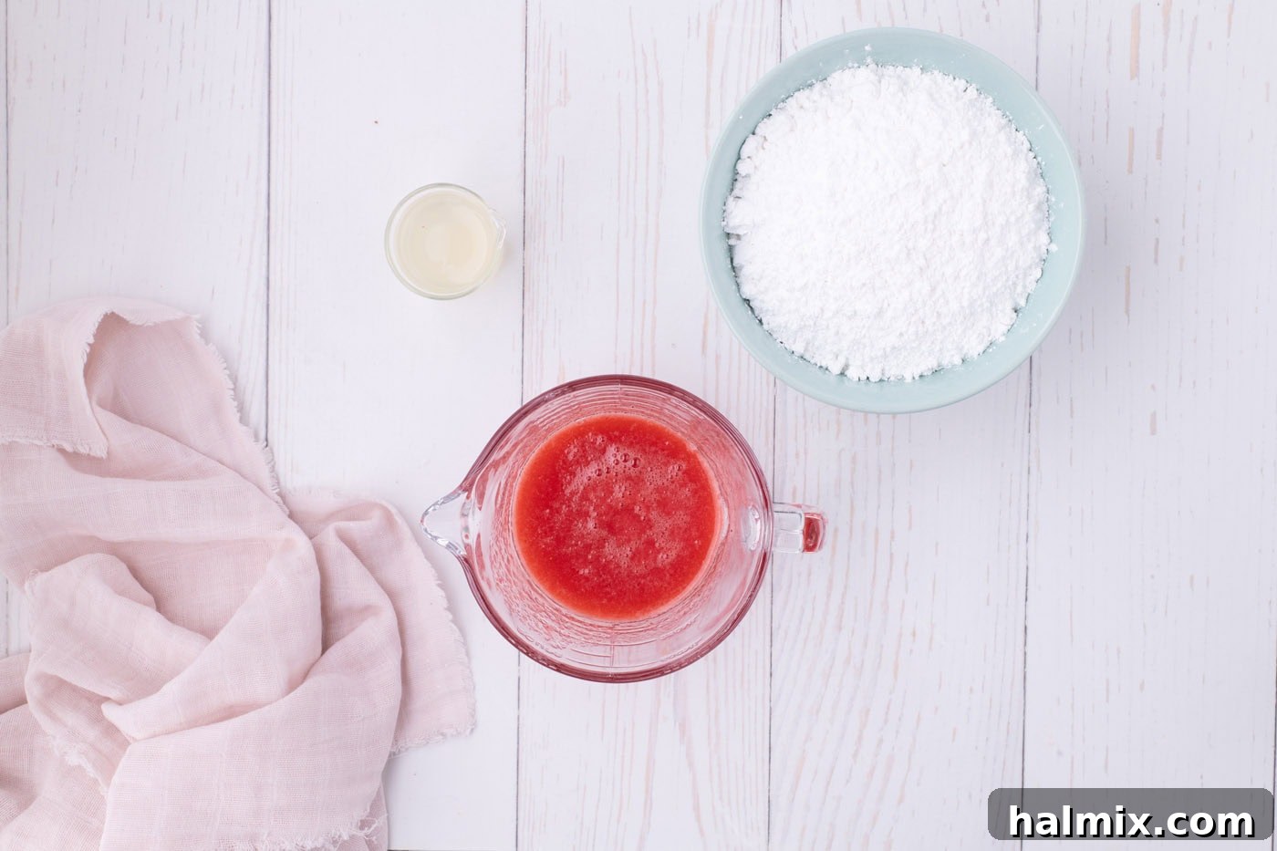 Fresh Strawberry Pound Cake 15 strawberry juice in a measuring cup next to powdered sugar
