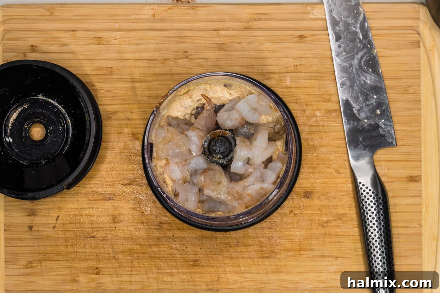 The second portion of shrimp is added to the chopper with the first blend.