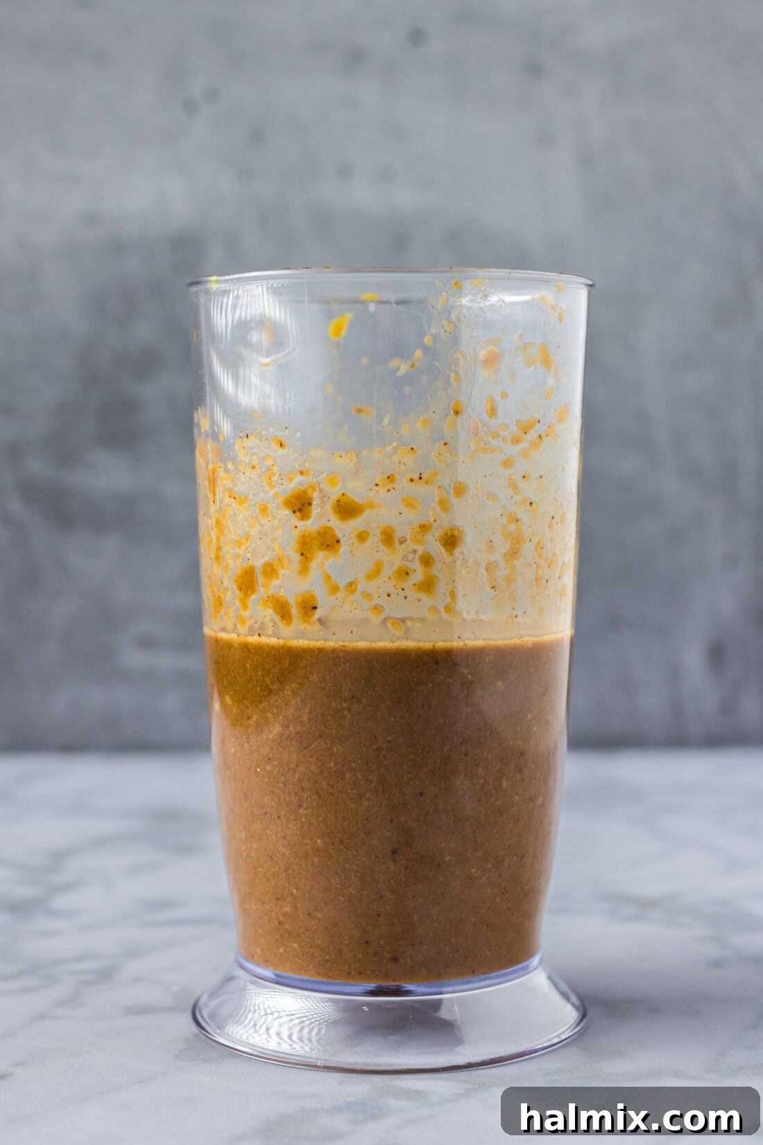 Sweet & Smoky Bourbon Marinade 2 Bourbon Marinade in an immersion blender cup, showcasing its rich, smooth texture ready to enhance any dish.