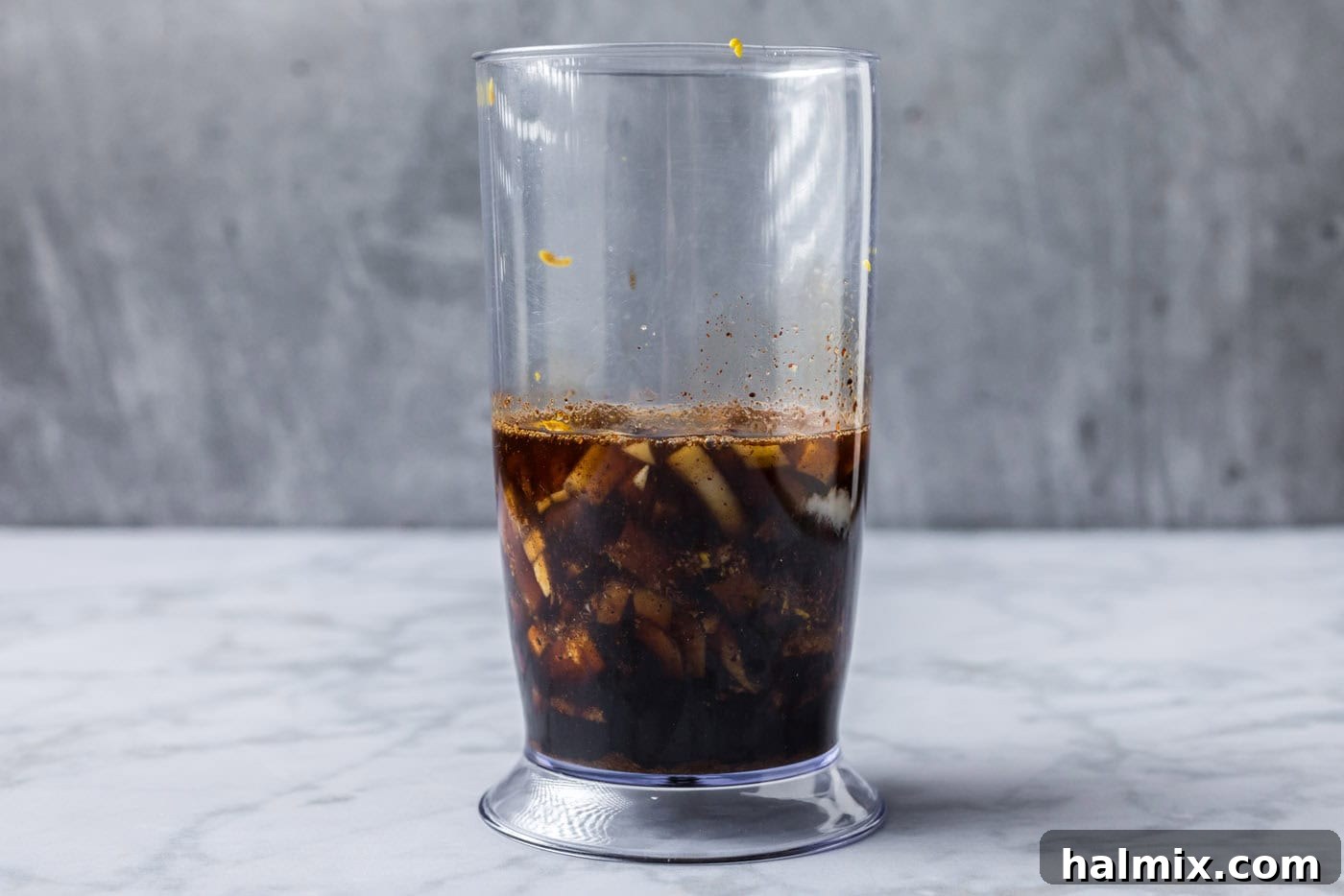 Sweet & Smoky Bourbon Marinade 5 All brown sugar bourbon marinade ingredients placed into an immersion blender cup, ready for blending.