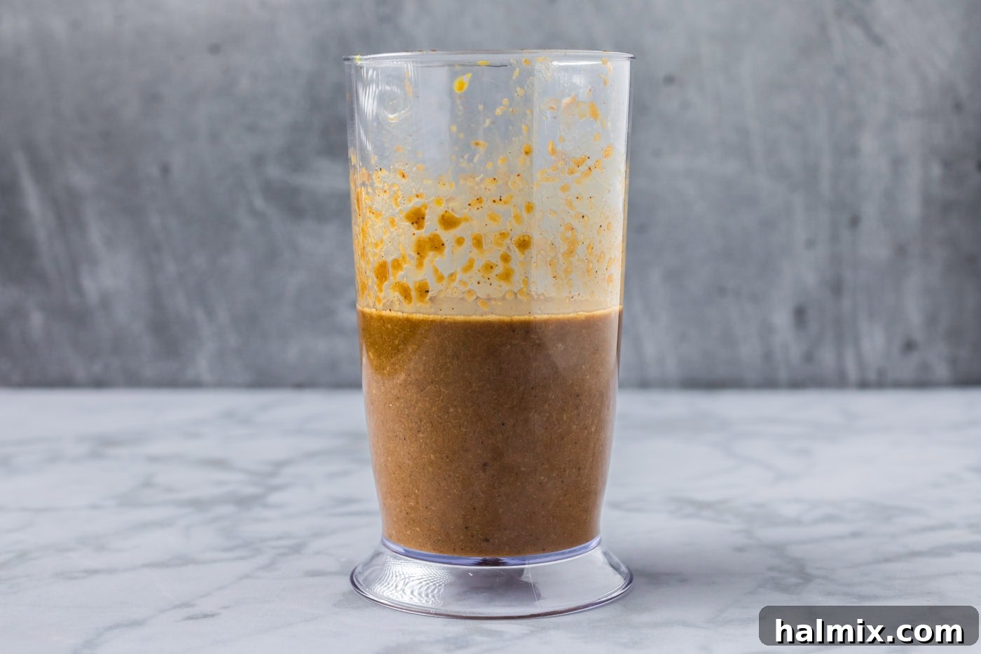 Sweet & Smoky Bourbon Marinade 6 Smooth, well-blended bourbon marinade captured in an immersion blender bottle after processing.