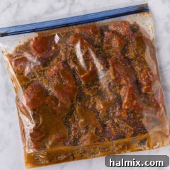 Close up photo of steak and Bourbon Marinade in a ziptop bag